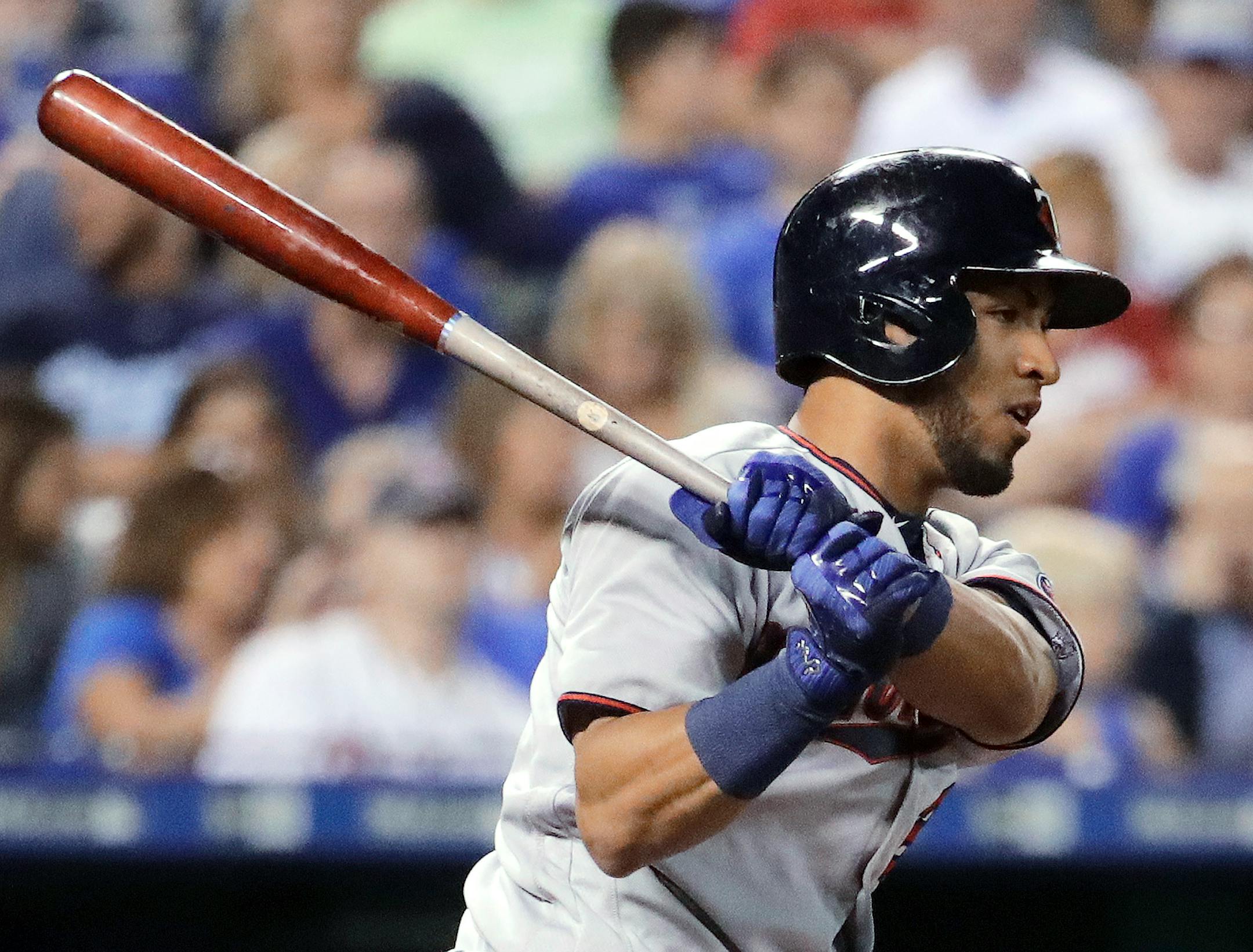 Minnesota Twins' Eddie Rosario watches his two-run single during the fourth inning of a baseball game against the Kansas City Royals on Friday, Sept. 8, 2017, in Kansas City, Mo. (AP Photo/Charlie Riedel)