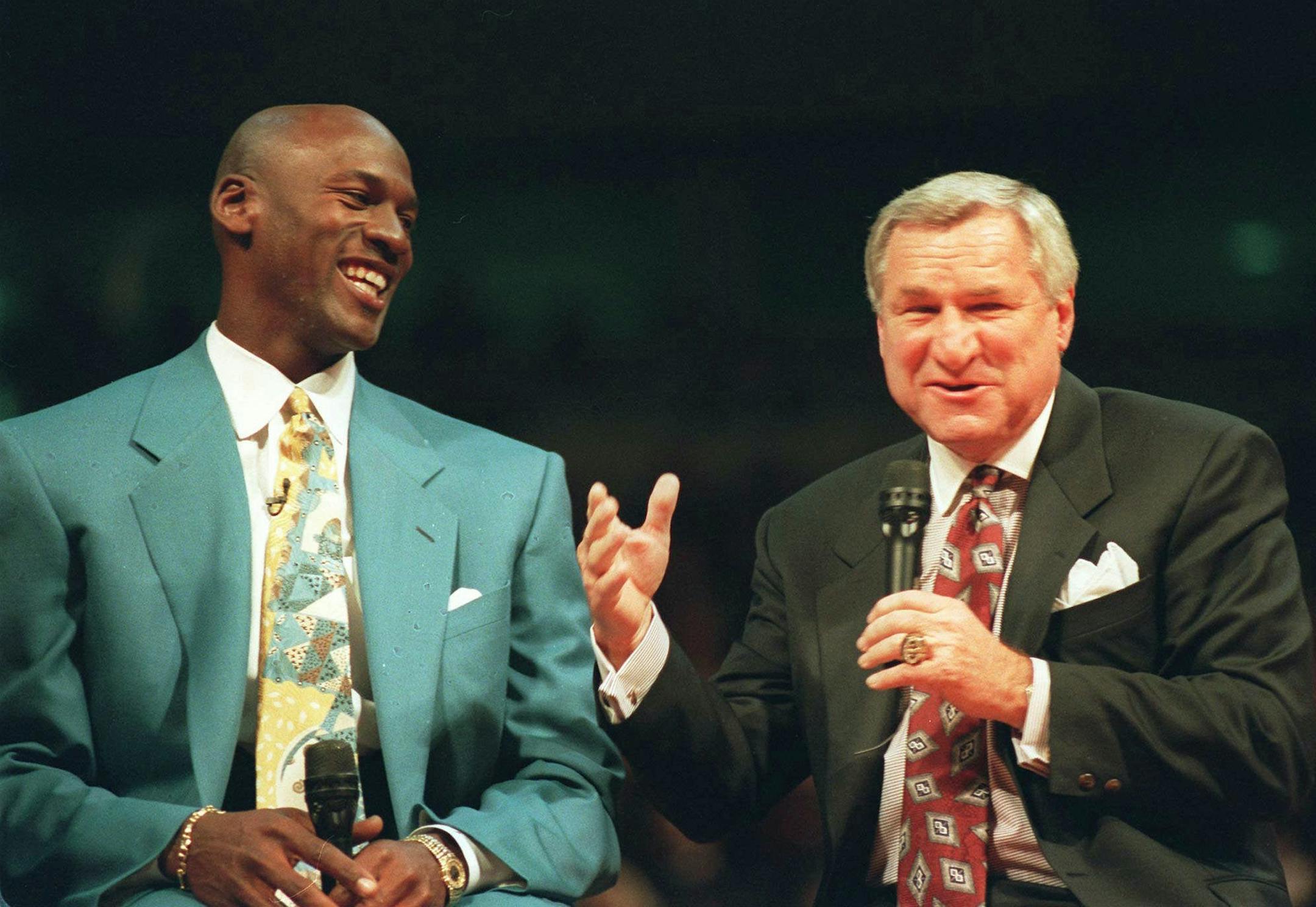 FILE -- Chicago Bulls' Michael Jordan, left, shares a moment with his former coach, University of North Carolina coach Dean Smith, during ceremonies honoring Jordan at Chicago's United Center, in this Nov. 1, 1994 photo. Smith, the winningest coach in college basketball history, announced his retirement Thursday Oct. 9, 12997 in Chapel Hill, N.C. (AP Photo/Pool)
