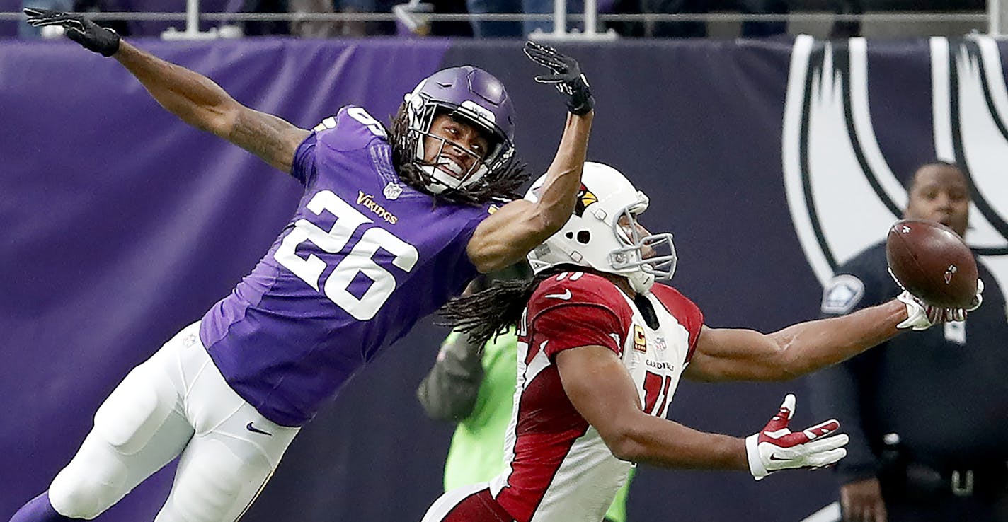 Larry Fitzgerald (11) caught a one handed pass while being defended by Trae Waynes (26) in the second quarter. ] CARLOS GONZALEZ cgonzalez@startribune.com - November 20, 2016, Minneapolis, MN, US Bank Stadium, NFL, Minnesota Vikings vs. Arizona Cardinals