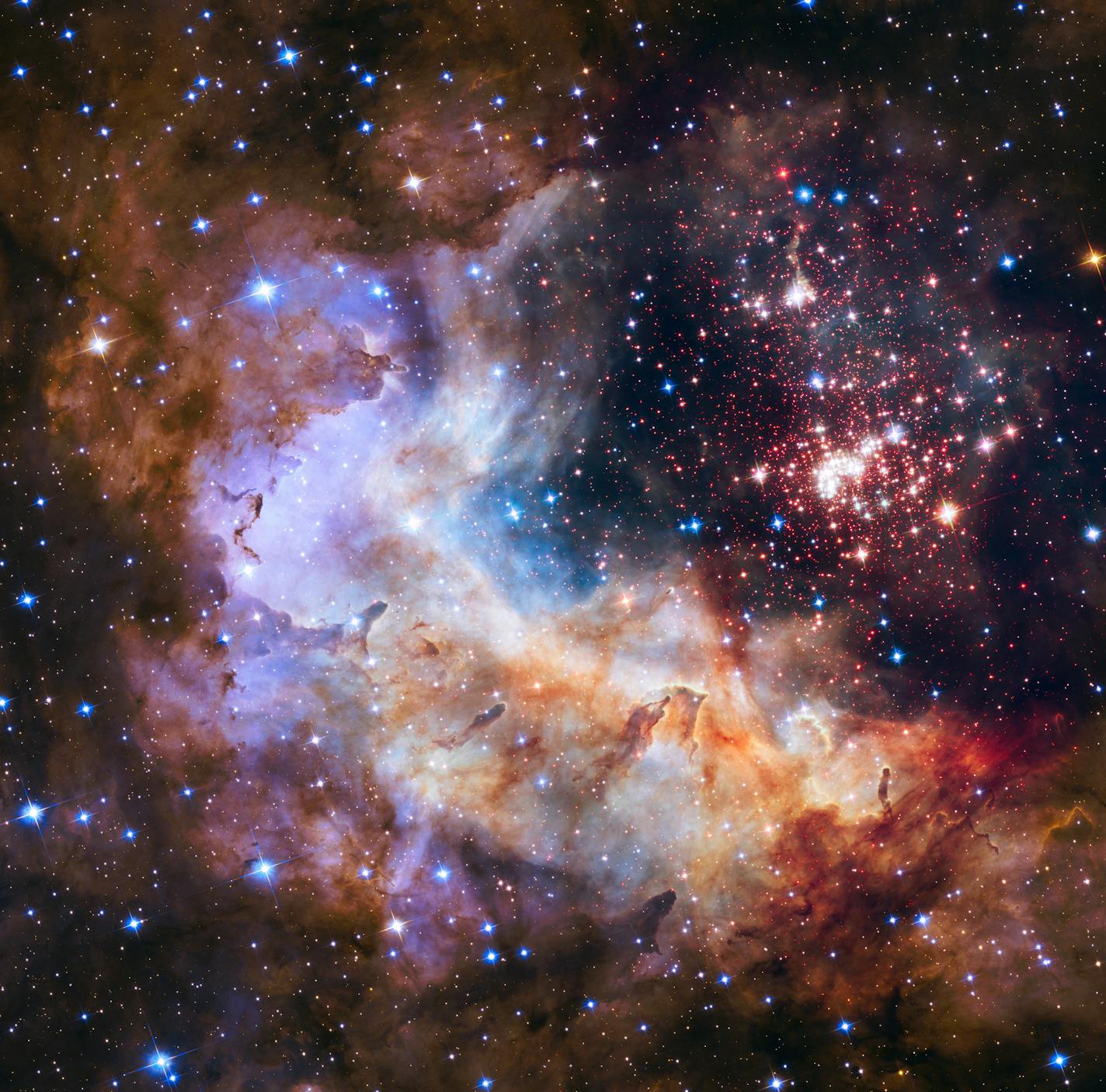 This undated photo provided by NASA shows an image taken by the Hubble Space Telescope showing a giant star cluster in the Constellation Carina, about 20,000 light years from Earth. Friday, April 24, 2015, marks the 25th anniversary of Hubble's launch. (NASA/ESA/Hubble Heritage Team/A. Nota, Westerlund 2 Science Team via AP)