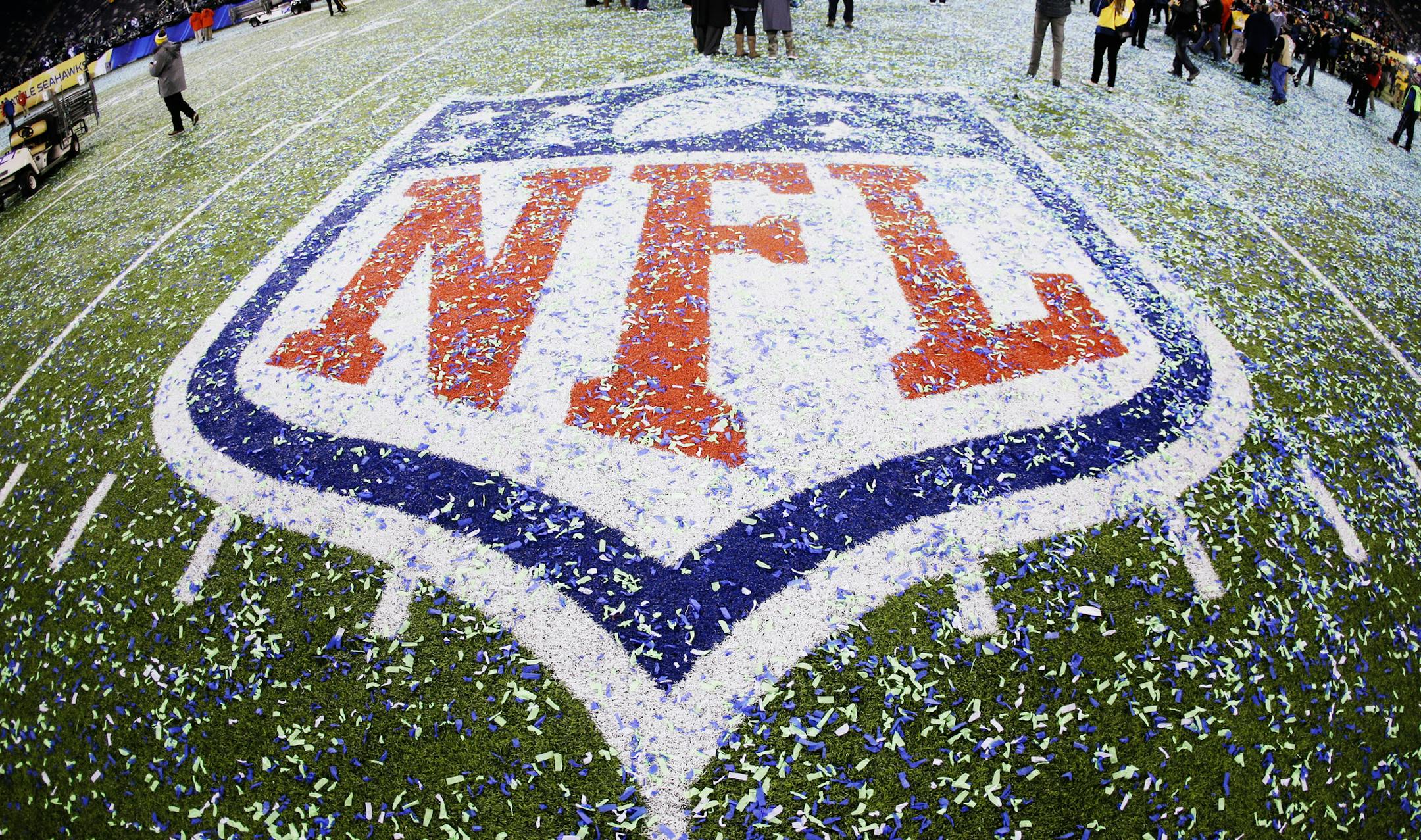The field and NFL logo are covered with confetti after the NFL Super Bowl XLVIII football game between the Seattle Seahawks and the Denver Broncos Sunday, Feb. 2, 2014, in East Rutherford, N.J. The Seahawks won 43-8. (AP Photo/Mark Humphrey) ORG XMIT: MIN2014032417300573