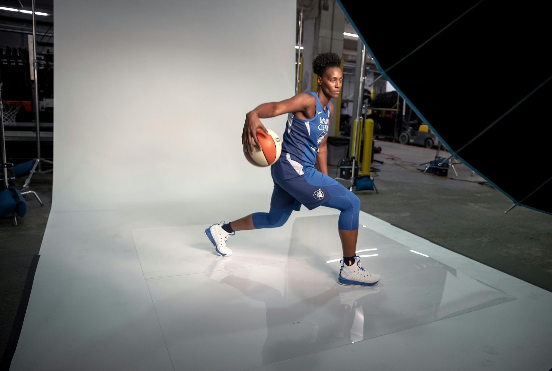 Minnesota Lynx center Sylvia Fowles listened to team photographer David Sherman during a photo shoot at Media day at the Target Center, Thursday, May 16, 2019 in Minneapolis, MN.