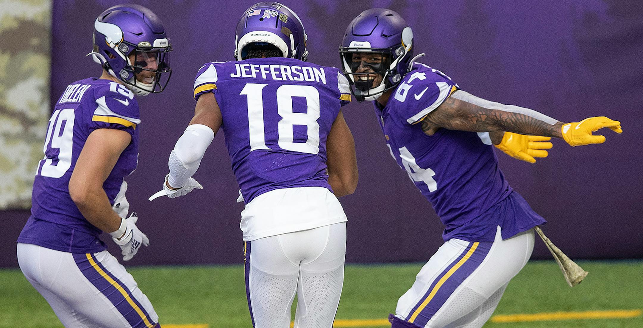 Minnesota Vikings tight end Irv Smith (84) celebrated his third quarter touchdown with Adam Thielen (19) and Justin Jefferson (18).