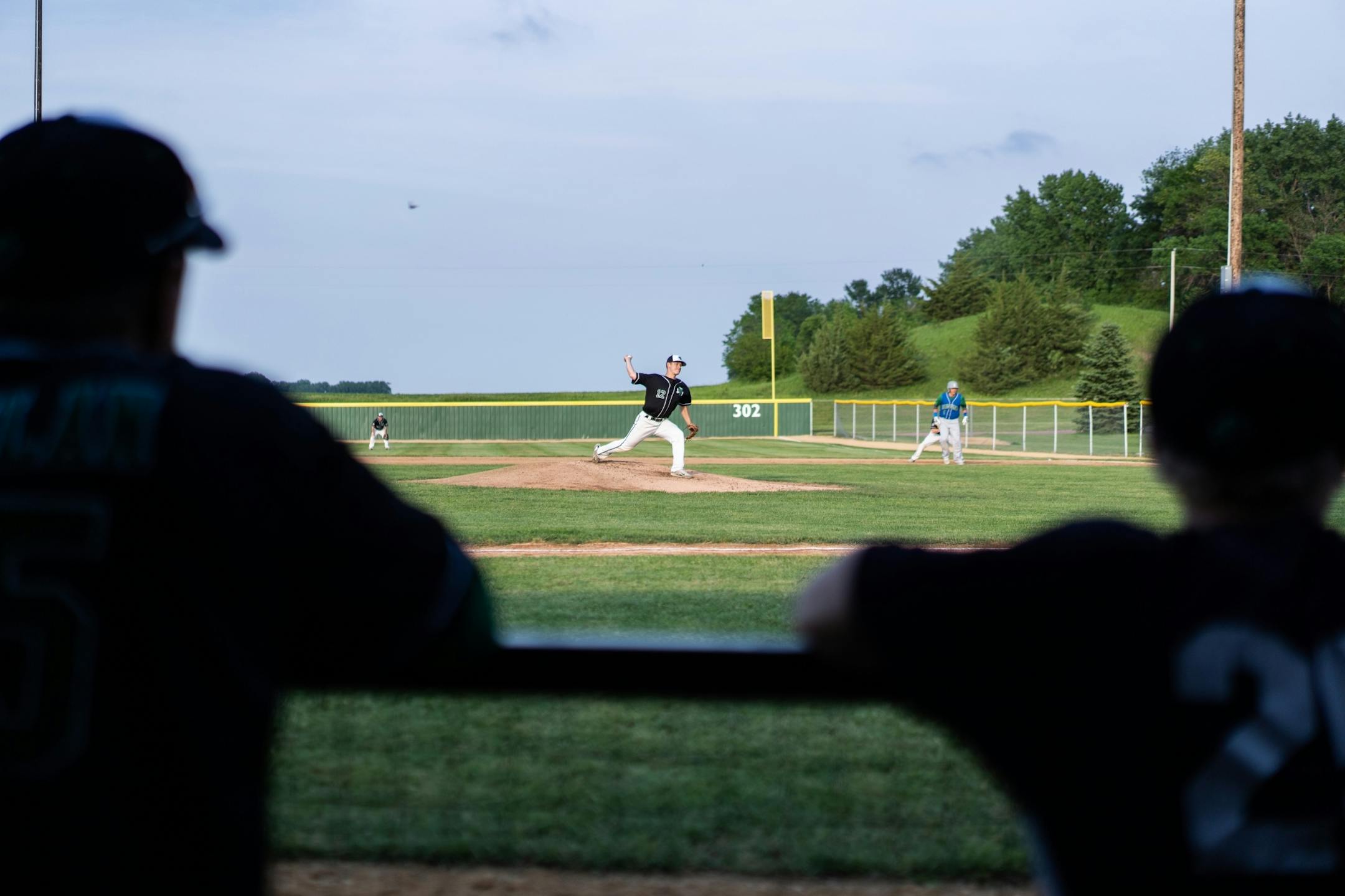 Tyler Peterson pitches for the Irish during a game against Bird Island at Irish Yard.