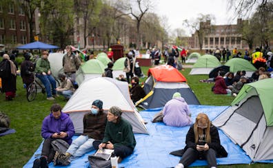 Demonstrators visited after setting up tents on the University of Minnesota's Northrop Mall lawn Monday in Minneapolis. Organizers said they planned t