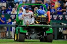 Twins third baseman Luis Arraez is taken from the game after an injury during the seventh inning