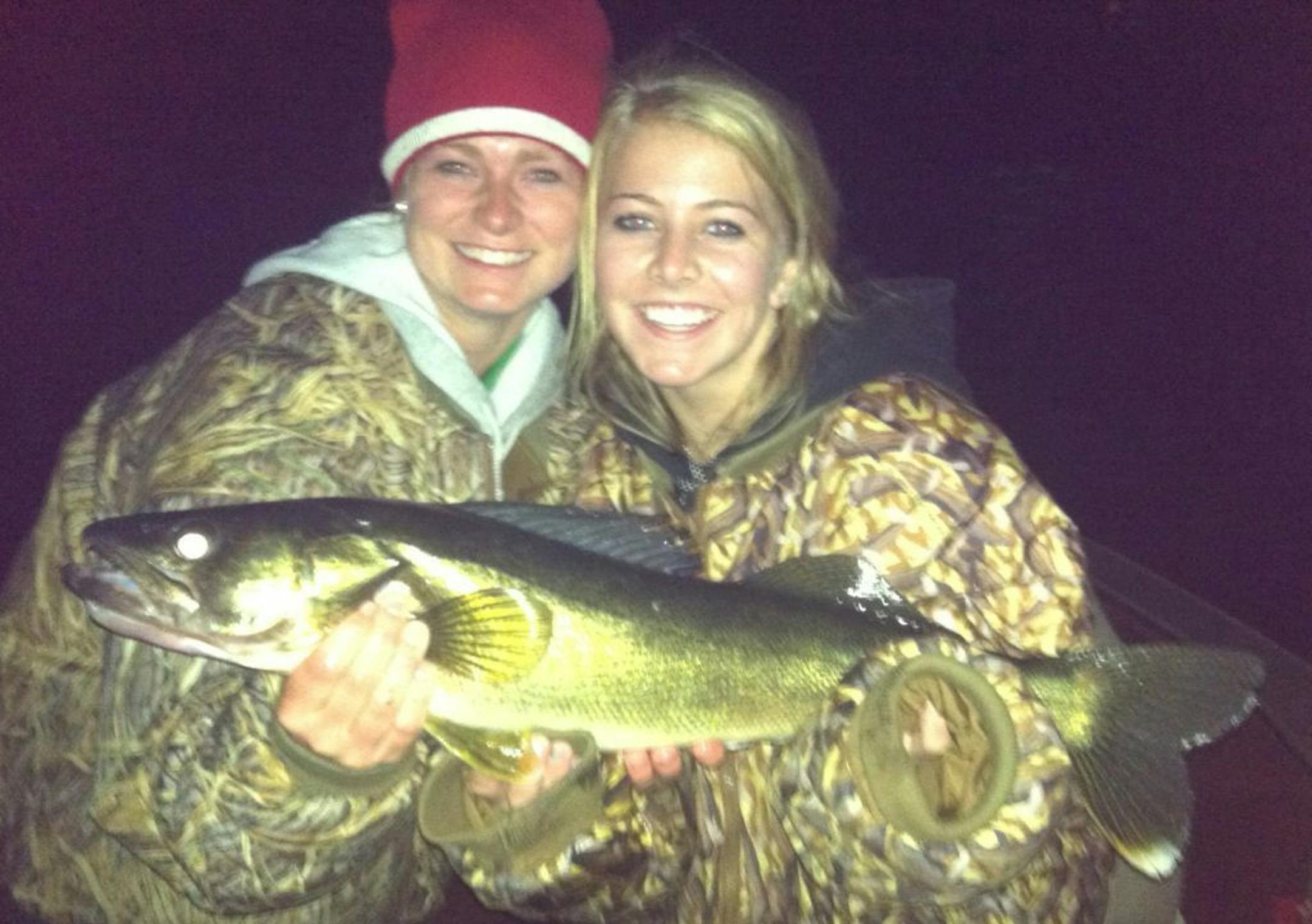 NIGHT ACTION Madelyn Mork (right) caught and released this 26-inch walleye while night-fishing on Gull Lake with her sister, Kayla, and her dad, Frank. �We caught a total of four walleyes, five northerns and a bass in two hours of fishing,�� Frank Mork said. The family lives in Victoria.