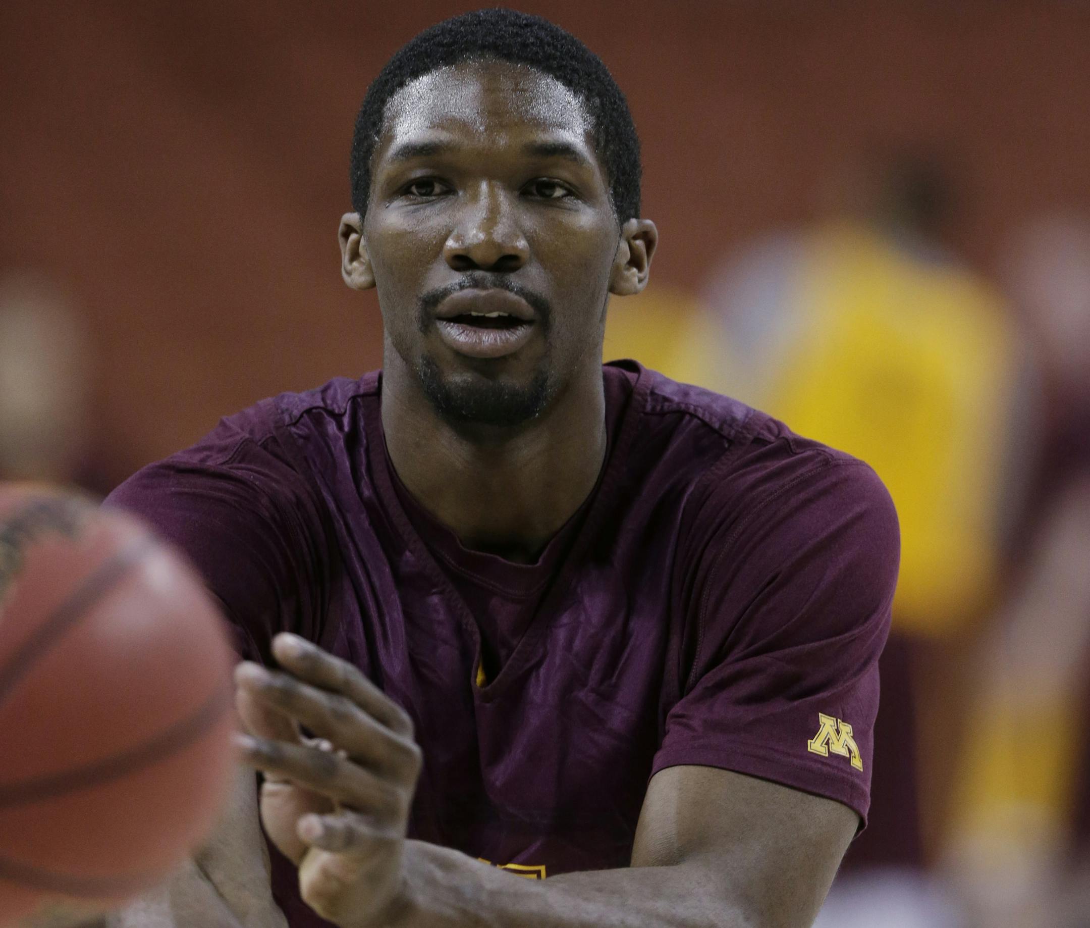 Minnesota's Trevor Mbakwe passes during practice for a second-round game of the NCAA college basketball tournament Thursday, March 21, 2013, in Austin, Texas. Minnesota is scheduled to play UCLA on Friday. (AP Photo/Eric Gay) ORG XMIT: TX