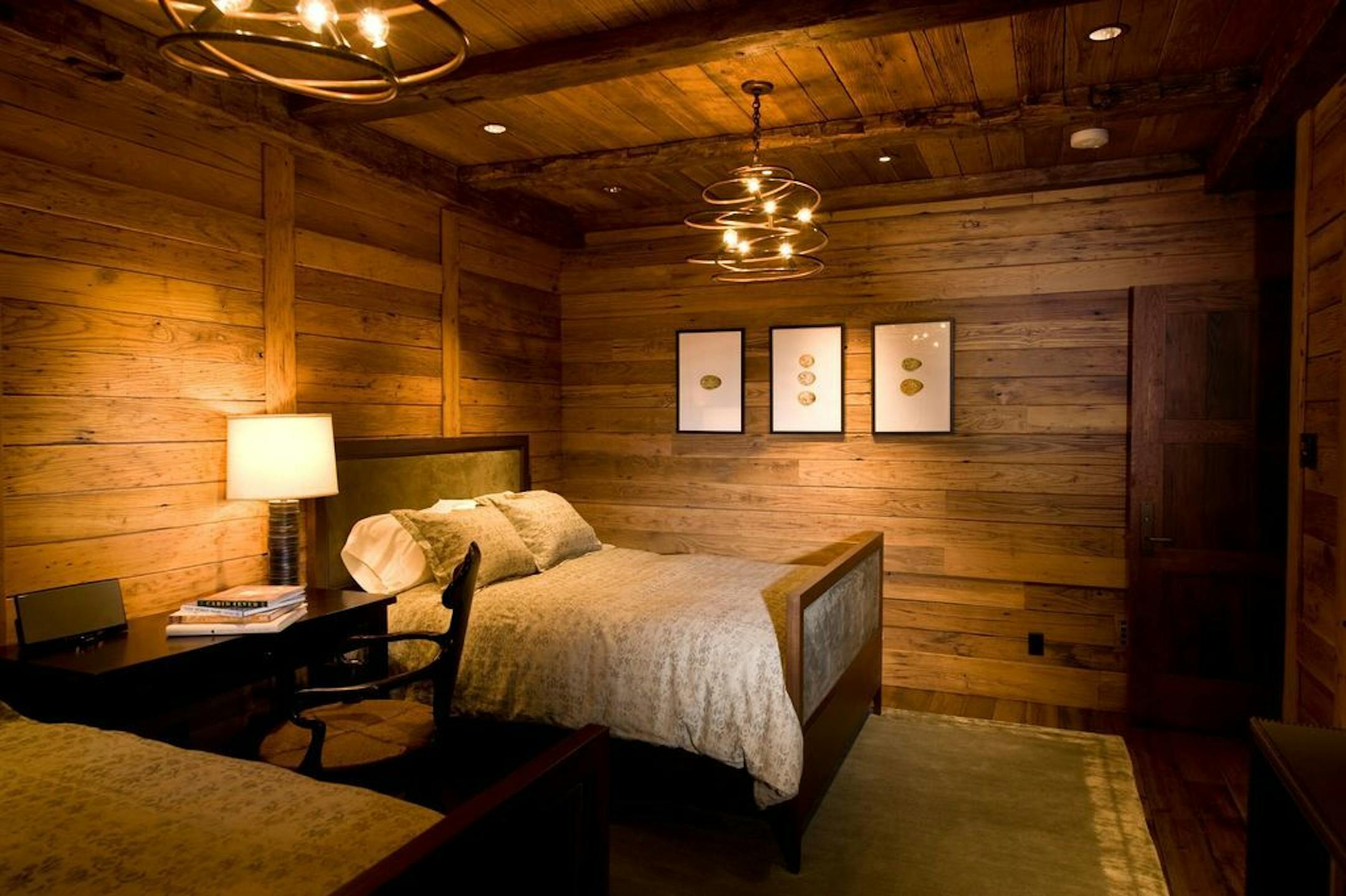 Another bedroom; all interiors are paneled in reclaimed wood.