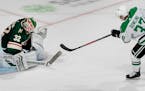 The Stars' Justin Dowling shot the puck past Wild goalie Alex Stalock for the game-winning goal in Dallas' 2-1 overtime victory Tuesday night in prese