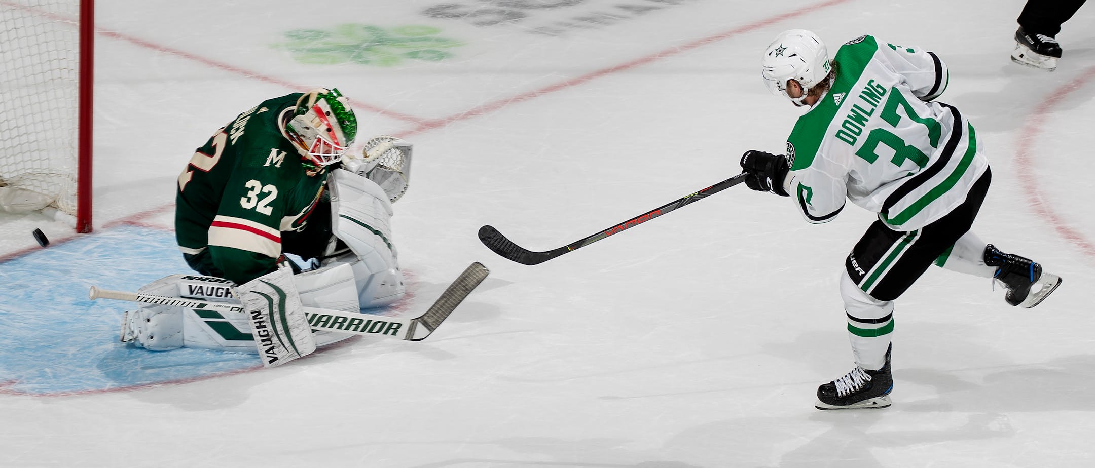 The Stars' Justin Dowling shot the puck past Wild goalie Alex Stalock for the game-winning goal in Dallas' 2-1 overtime victory Tuesday night in preseason hockey at Xcel Energy Center.