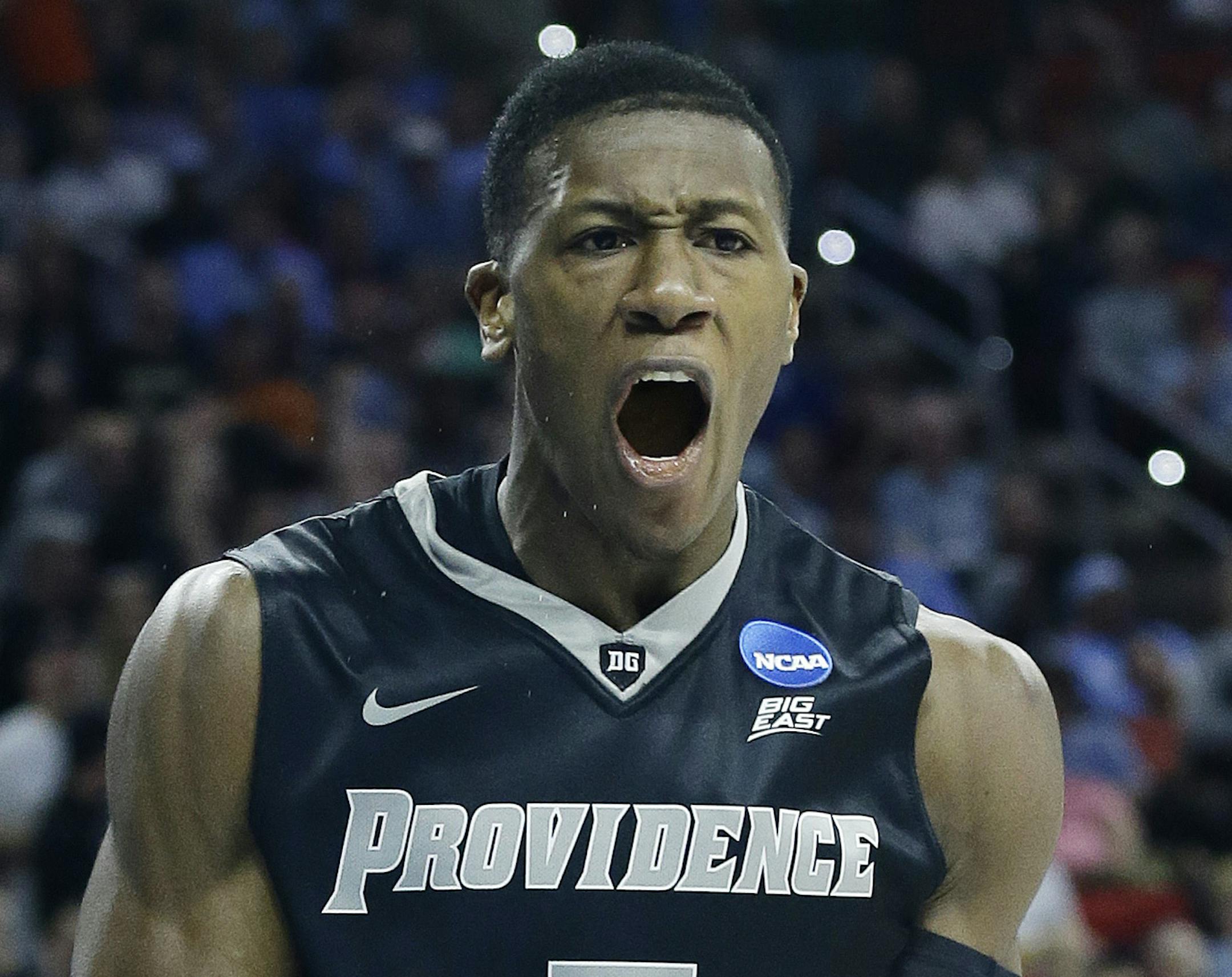 Providence guard Kris Dunn (3) reacts after a dunk against North Carolina during the second half of a second-round men's college basketball game in the NCAA Tournament, Saturday, March 19, 2016, in Raleigh, N.C. (AP Photo/Gerry Broome) ORG XMIT: NCMS172