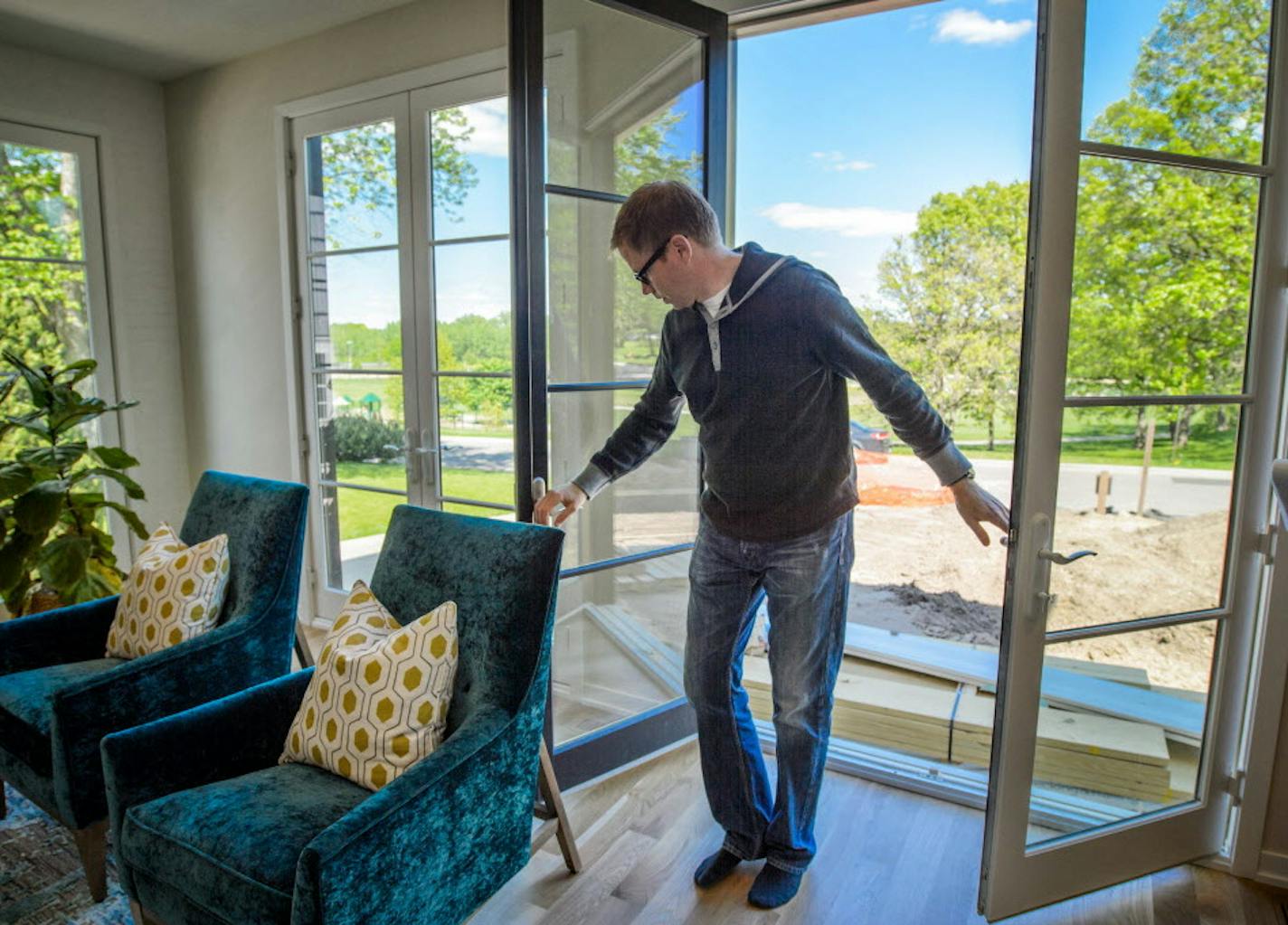 Double French doors on first floor. ] GLEN STUBBE * gstubbe@startribune.com Tuesday, May 17, 2016 Highlight from the upcoming Artisan Home Tour, a modern house in an established traditional neighborhood in Edina. This year's tour marks the return of the upper-bracket spec house; they all but disappeared when the housing market tanked. The builder Andy Porter is in some of the photos as is designer Bridget Burns of Blend Interior Design. Home is 6028 Oaklawn Ave. S., Edina, MN