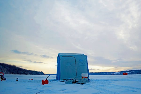 Appearing cold and desolate, portable ice-fishing shelters — this one recently on the St. Croix River — have revolutionized the sport, keeping ang
