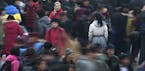 FILE - In this Jan. 8, 2012 file photo, people rush to catch their train at Beijing station in Beijing, China as millions of Chinese are expected to c