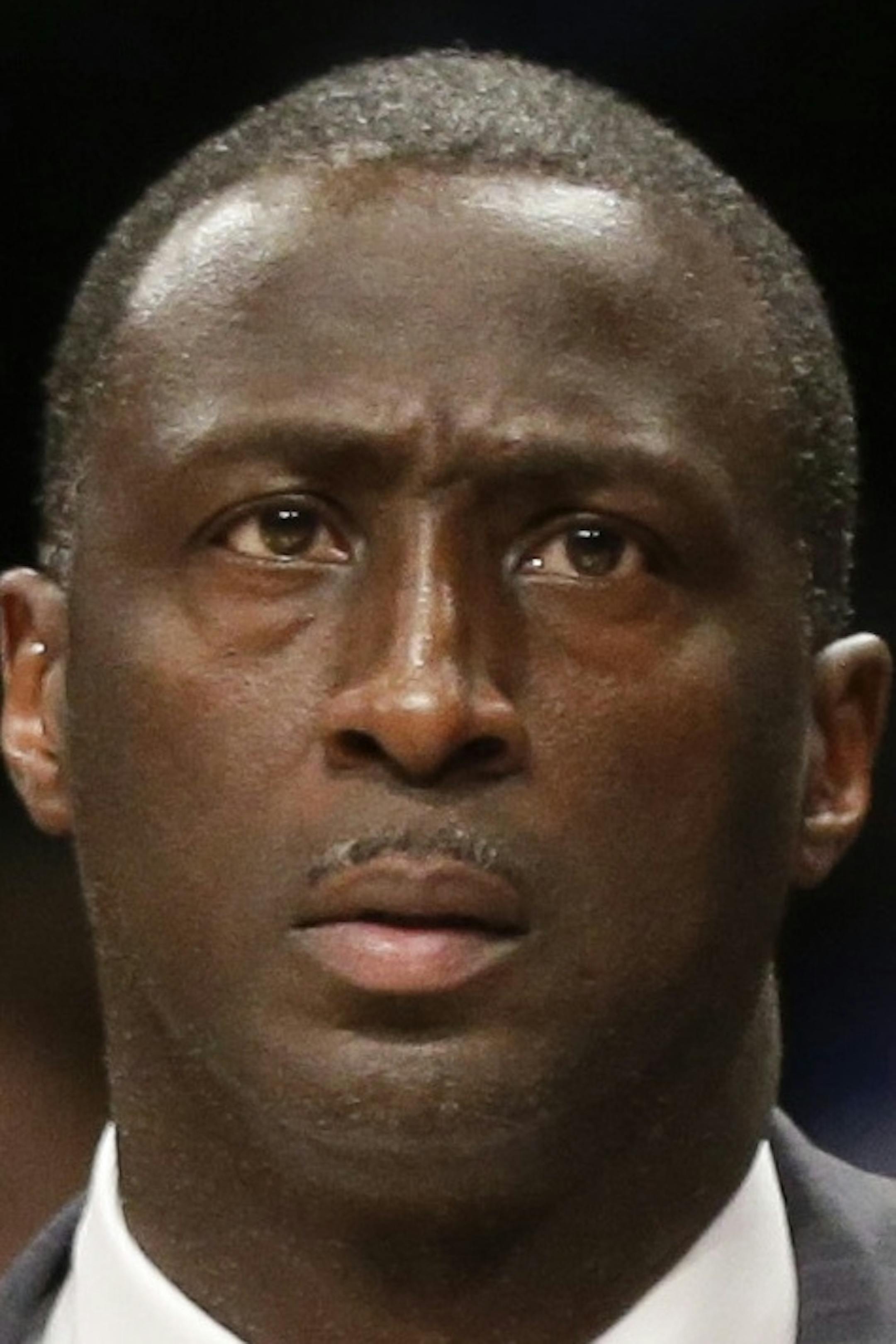 Sacramento Kings head coach Tyrone Corbin watches his team play during the first half of an NBA basketball game against the Brooklyn Nets, Monday, Dec. 29, 2014, in New York. (AP Photo/Frank Franklin II)