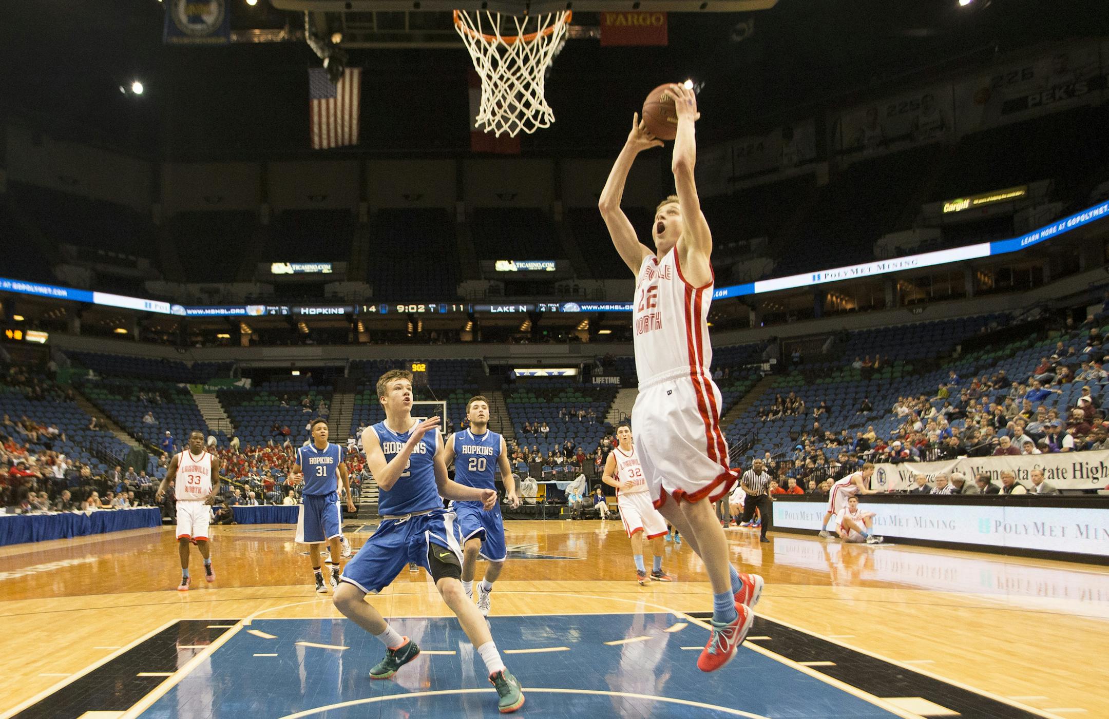 Lakeville North defender Carter Brooks (22) gets a layup off a breakaway against Hopkins during the first half. ] (Aaron Lavinsky | StarTribune) Lakeville North plays Hopkins in the Class 4A boys' basketball quarterfinals on Wednesday, March 11, 2015 at Target Center.