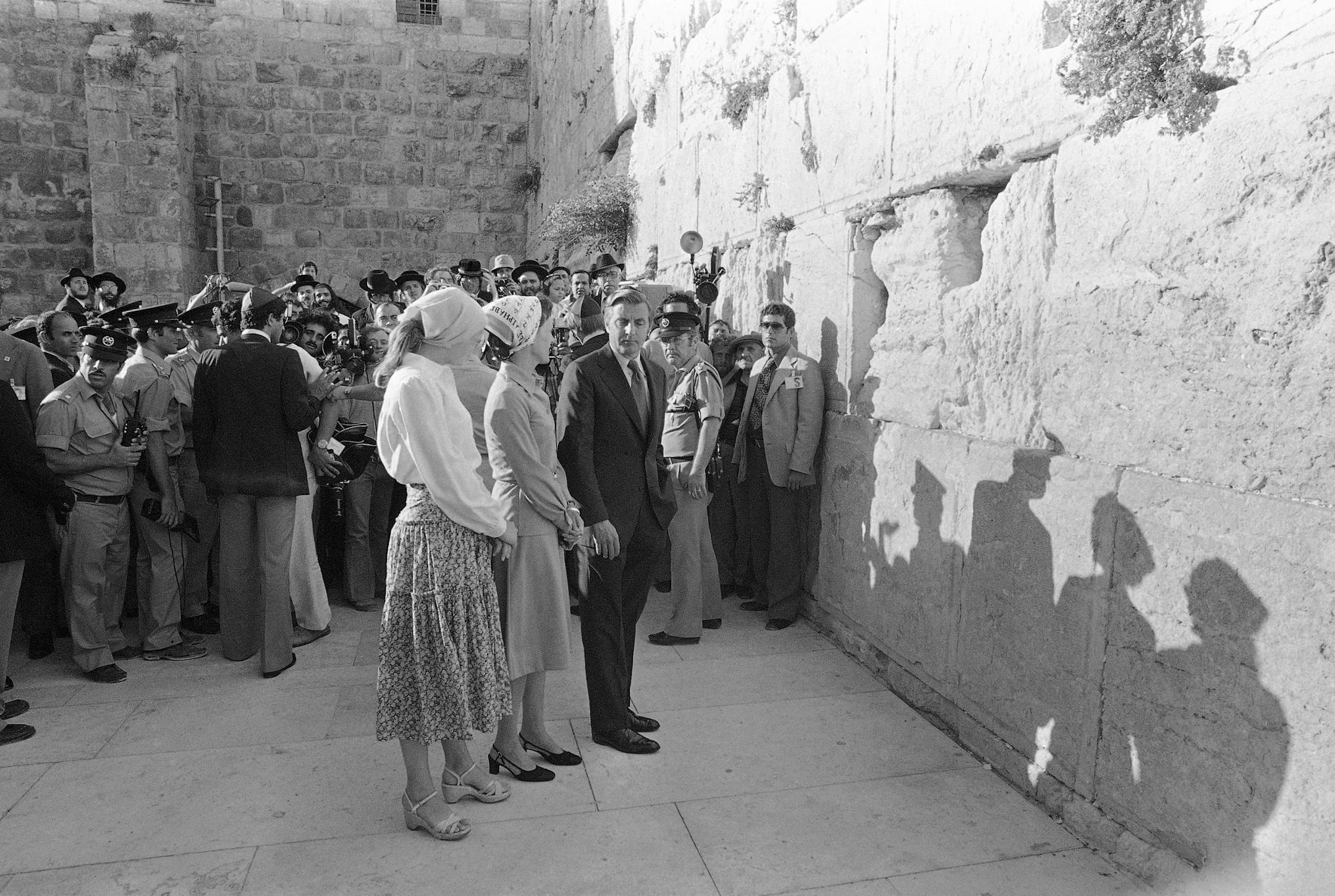 U.S. Vice President Walter Mondale, right, his wife Joan, and daughter Eleanor, left, bend their heads in prayer, July 1, 1978 at the Wailing Wall in Jerusalem. They had just arrived in Israel a few hours before.