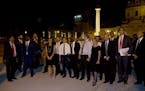 Rome's mayor Ignazio Marino, fourth from left, arrives with mayors from around the world to attend a performance in Rome's Foro di Augusto, Tuesday, J