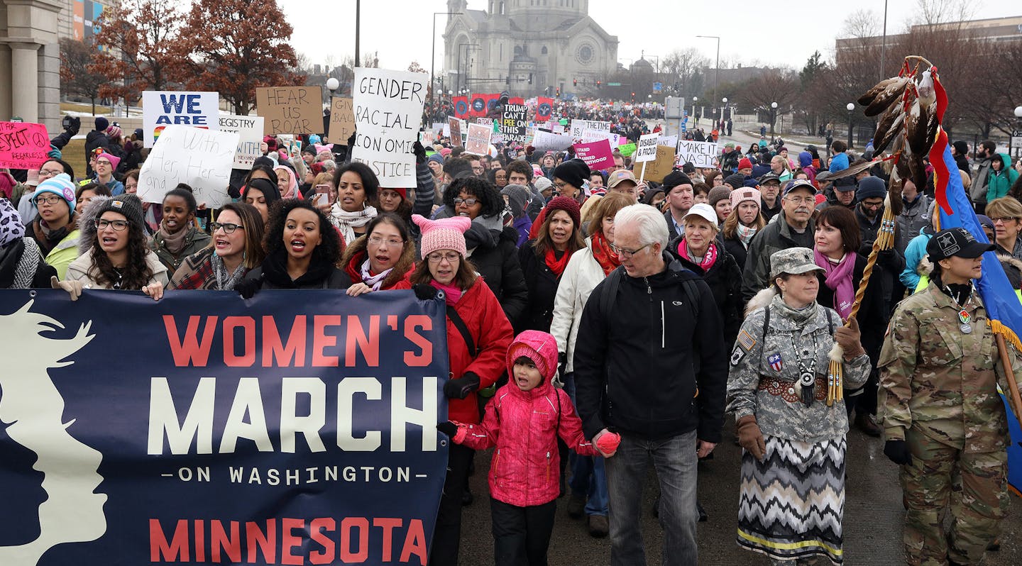 A young girl stood front and center at the front of the procession from St. Paul College to the State Capitol for the noon rally. ] ANTHONY SOUFFLE &#x2022; anthony.souffle@startribune.com Women's activists and supporters gathered at St. Paul College then marched to the State Capitol for a noon rally Saturday, Jan. 21, 2017 for a local version of the big national D.C. women's march. ORG XMIT: MIN1701211543353332