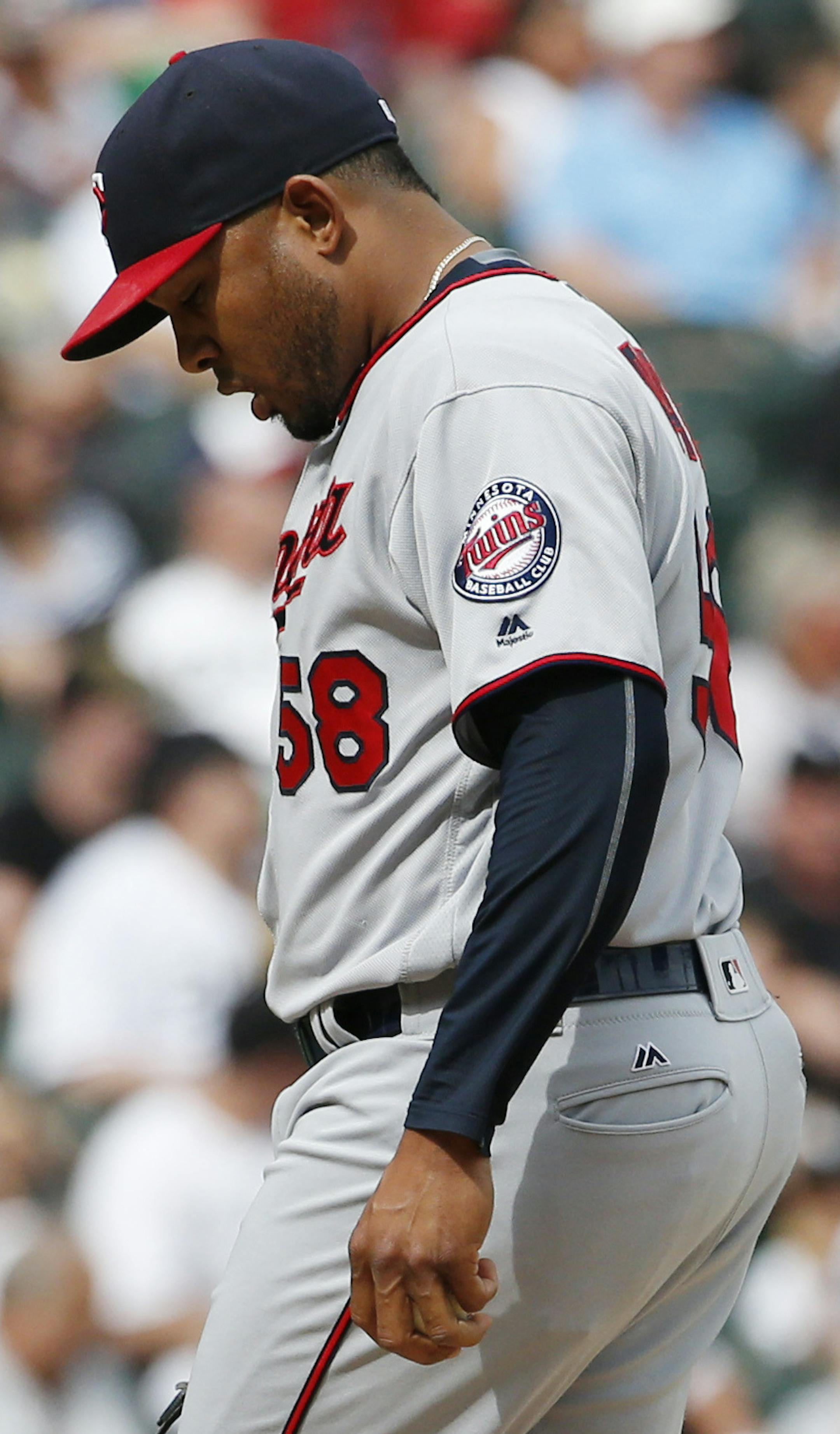 Minnesota Twins relief pitcher Fernando Abad kicks at the dirt after giving up a single to Chicago White Sox's J.B. Shuck during the eighth inning of a baseball game in Chicago, Thursday, June 30, 2016. The White Sox won 6-5. (AP Photo/Nam Y. Huh)