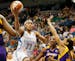 Maya Moore drove to the basket on Nneka Ogwumike, and Armintie Herrington of the Sparks during WNBA action between the Minnesota Lynx and Los Angeles 