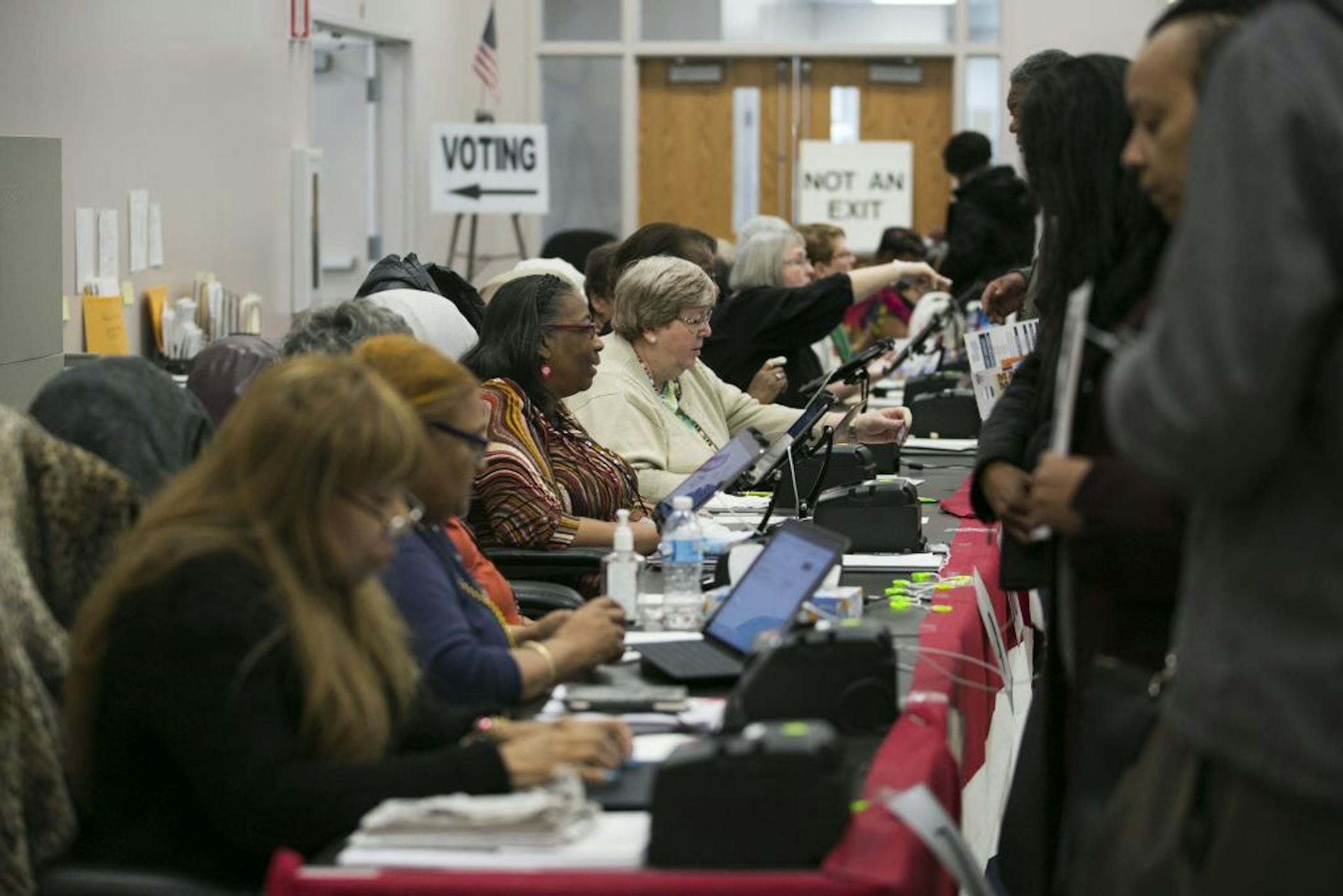 FILE -- Ohioans vote early in Columbus, March 16, 2020. The governor canceled the primary and wants to reschedule it for June 2.