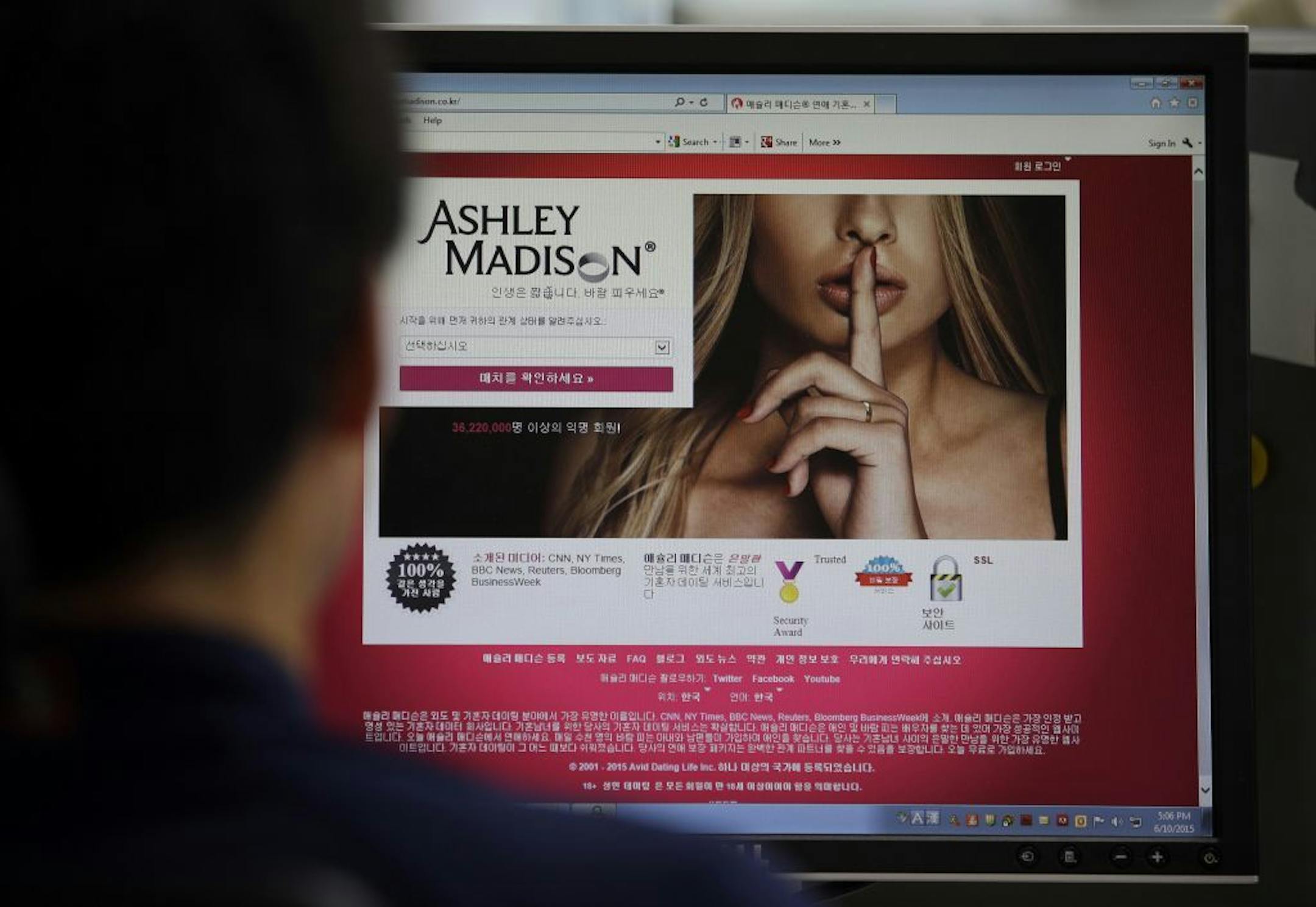 FILE - A June 10, 2015 photo from files showing Ashley Madison's Korean web site on a computer screen in Seoul, South Korea. U.S. government employees with sensitive jobs in national security or law enforcement were among hundreds of federal workers found to be using government networks to access and pay membership fees to the cheating website Ashley Madison, The Associated Press has learned. The list includes at least two assistant U.S. attorneys, an information technology administrator in the