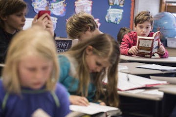 Students read last year at Marine Elementary in Marine on St. Croix, one of the sites the district decided to close. The others are in Hugo and Stillw