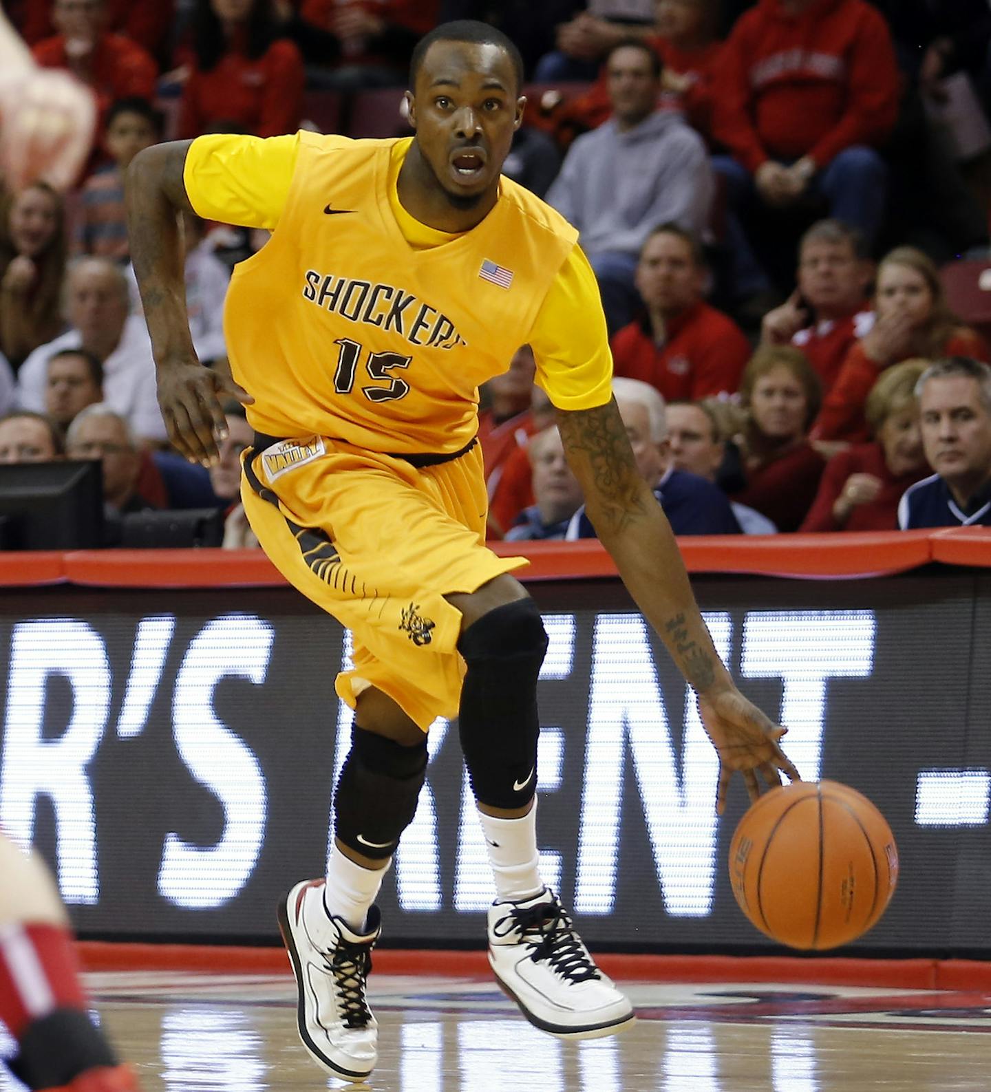 Wichita State guard Nick Wiggins (15) pushes down the court against Illinois State during the first half of an NCAA college basketball game at Redbird Arena, Wednesday, Jan. 22, 2014, in Normal, Ill. (AP Photo/ Stephen Haas) ORG XMIT: ILSH110