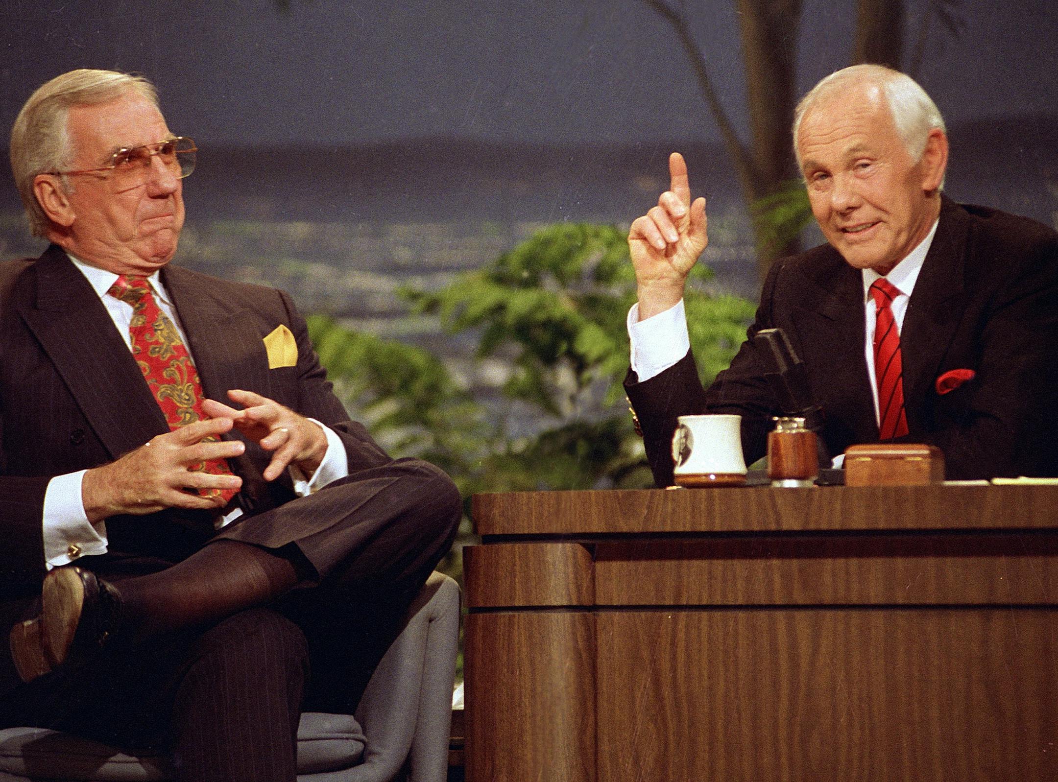 In this May 22, 1992 file photo, Ed McMahon, left, and host Johnny Carson are shown on "The Tonight Show" for their final broadcast in Burbank, Calif. With his debut as host of NBC's "The Tonight Show" 50 years ago this October, until he retired from the show on May 22, 1992, he was seen by more people on more occasions than anyone else in American history. "Johnny Carson: King of Late Night," a two-hour "American Masters" portrait premiers Monday at 9 p.m. EDT on PBS. (AP Photo/Douglas Pizac, f
