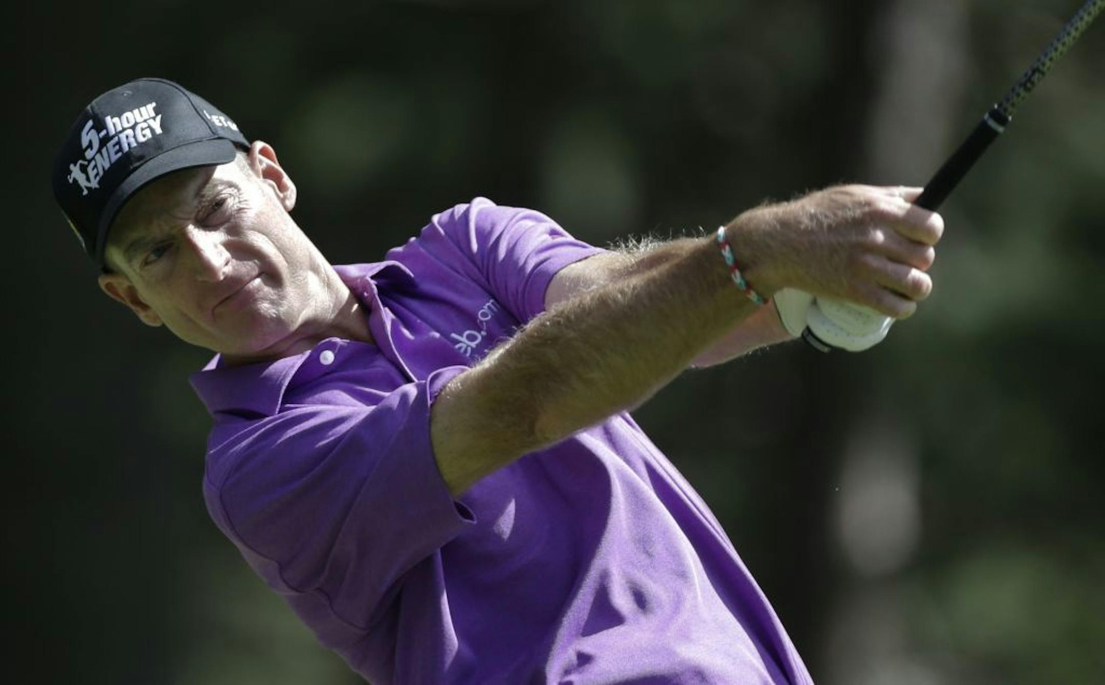 Jim Furyk watches his tee shot on the fourth hole during the third round of the PGA Championship golf tournament at Oak Hill Country Club, Saturday, Aug. 10, 2013, in Pittsford, N.Y.