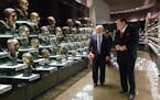 David Baker, the president of the Pro Football Hall of Fame, right, gives a tour to Republican presidential candidate Donald Trump, Wednesday, Sept. 1