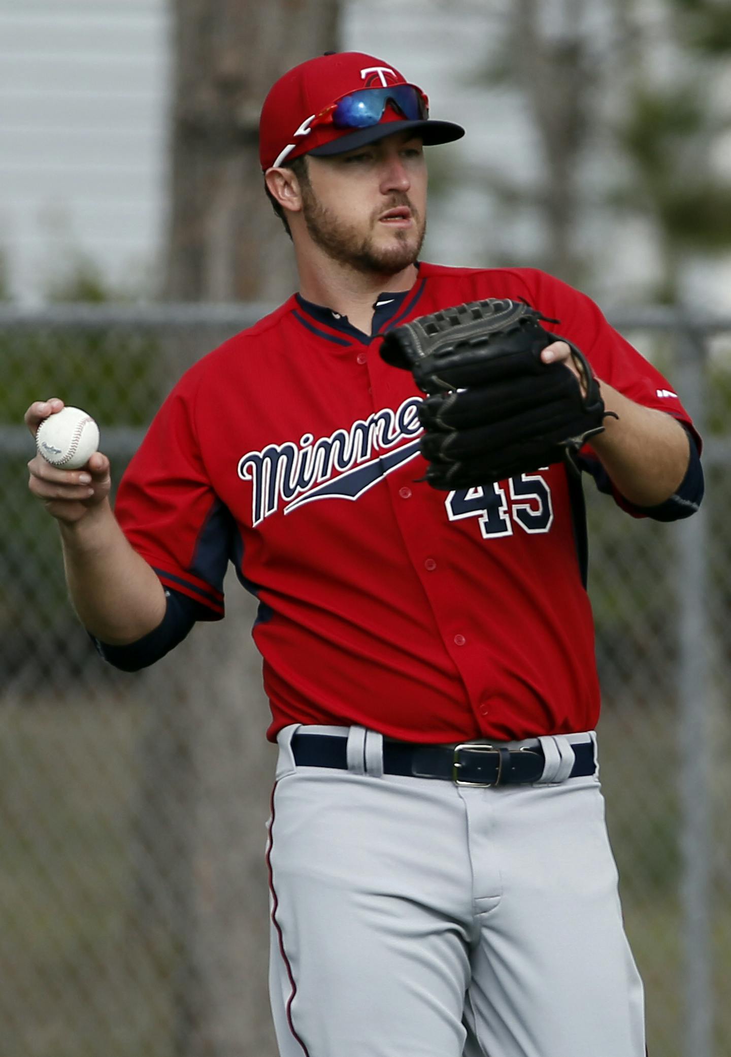 Minnesota Twins' Phil Hughes throws as he warms up before a workout at baseball spring training in Fort Myers Fla., Tuesday Feb. 24, 2015. (AP Photo/Tony Gutierrez)