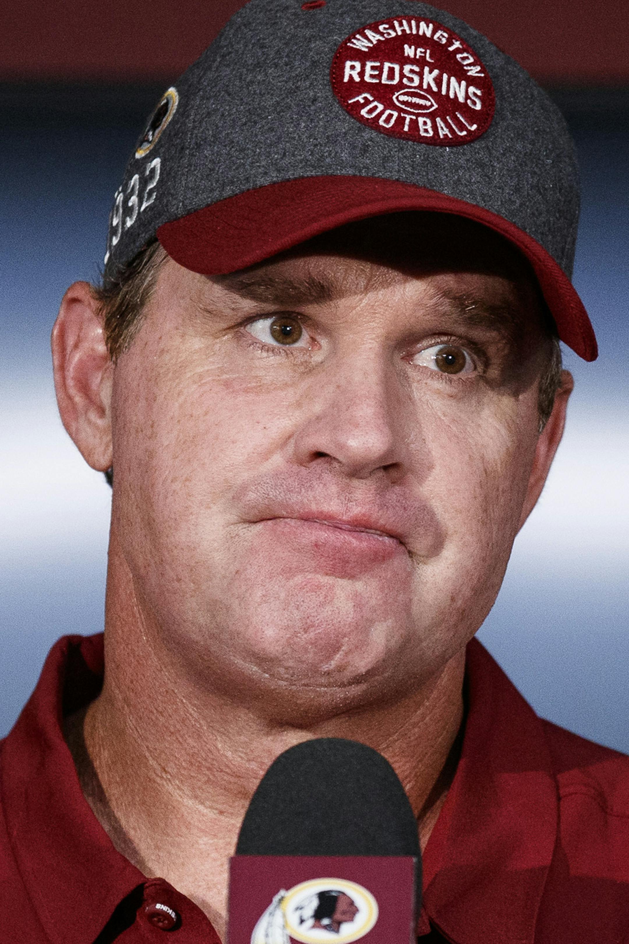 FILE - In this Sept. 15, 2019, file photo, Washington Redskins head coach Jay Gruden pauses while speaking during a news conference after an NFL football game against the Dallas Cowboys, in Landover, Md. Gruden was fired as head coach of the Washington Redskins on Monday, Oct. 7, 2019, after an 0-5 start to the sixth season of a tenure that featured only one playoff appearance. (AP Photo/Alex Brandon, File)