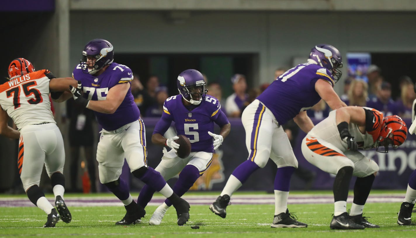 Vikings quarterback Teddy Bridgewater looked for a receiver before throwing his first pass - an interception - moments after returning to playing after a knee injury more than a year ago.