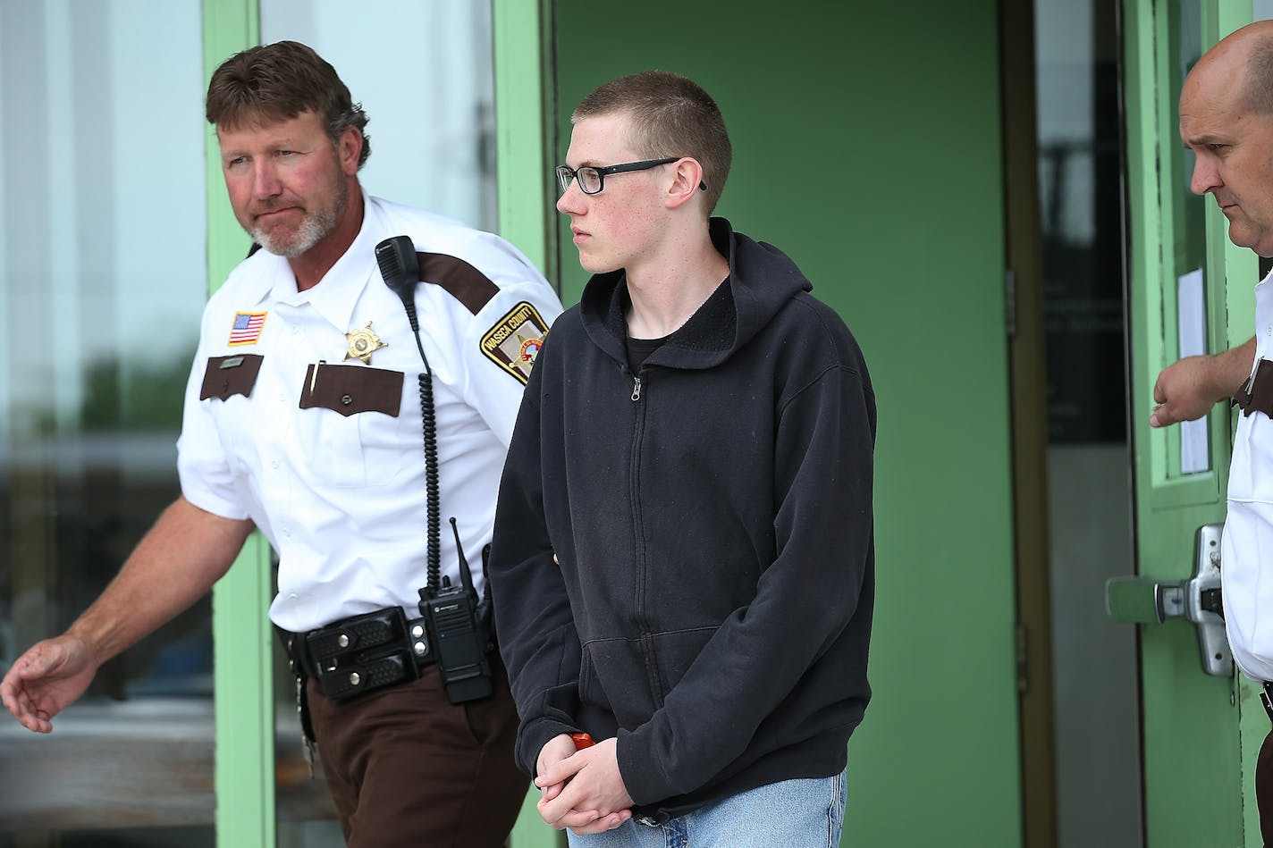 John LaDue, the would-be school shooter in Waseca, was escorted out of the Waseca County Cout House after he made an appearance in court for a hearing on whether he should be certified as an adult, Tuesday, June 30, 2015 in Waseca, MN.