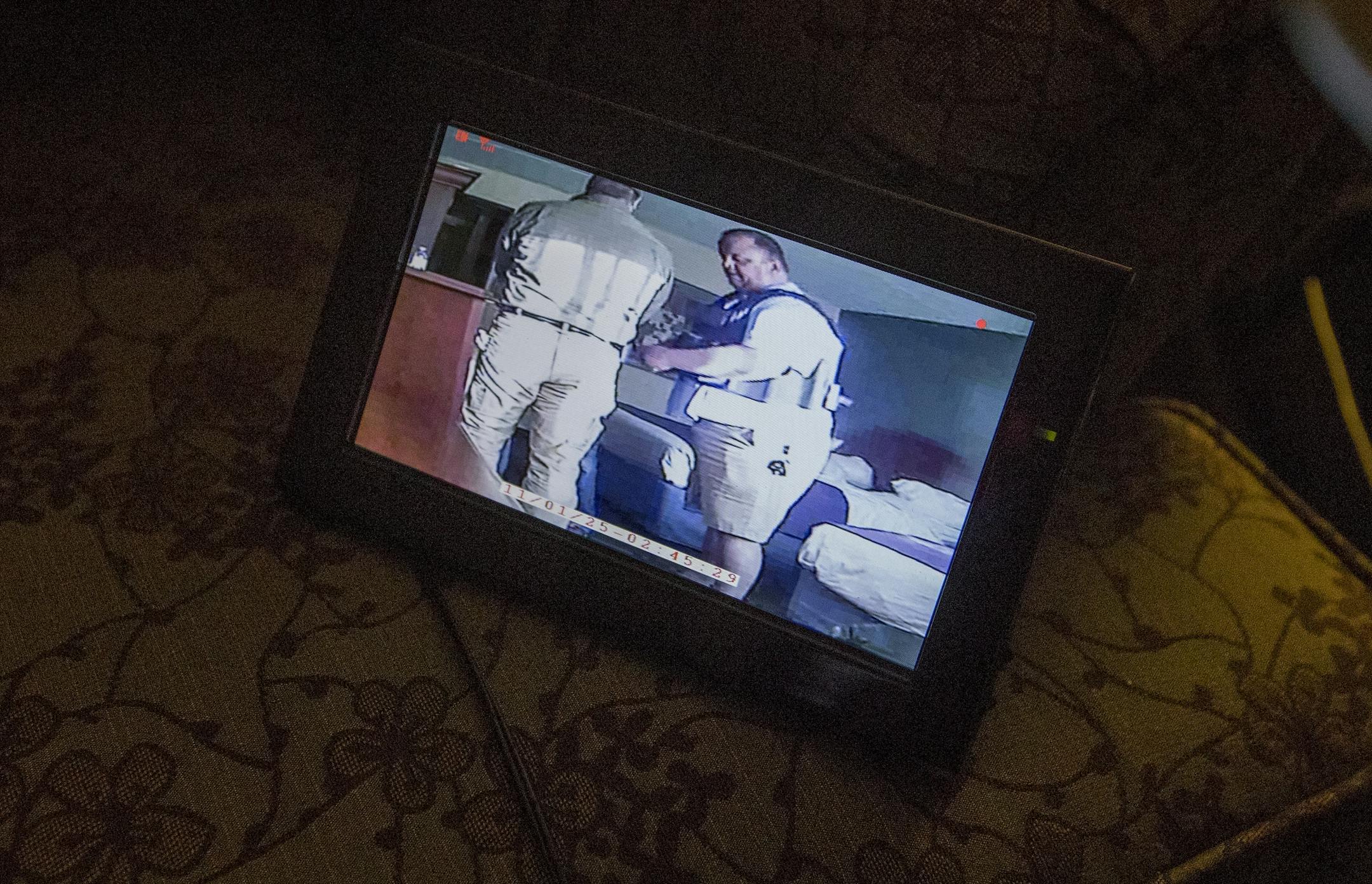 Nicollet County sheriff's investigator Marc Chadderon spoke to a man arrested for soliciting (viewed through a monitor) during a prostitution sting in St. Peter, Minn.