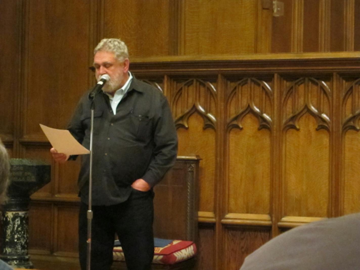 Duluth poet Louis Jenkins, shown here in April introducing Robert Bly. Photo by Laurie Hertzel.