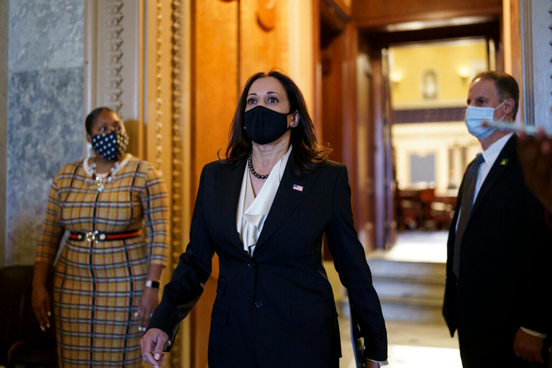 Vice President-elect Sen. Kamala Harris, D-Calif., strides from the Senate chamber after voting against President Donald Trump's controversial choice for the Federal Reserve Board of Governors, Judy Shelton, at the Capitol in Washington, Tuesday, Nov. 17, 2020. (AP Photo/J. Scott Applewhite)
