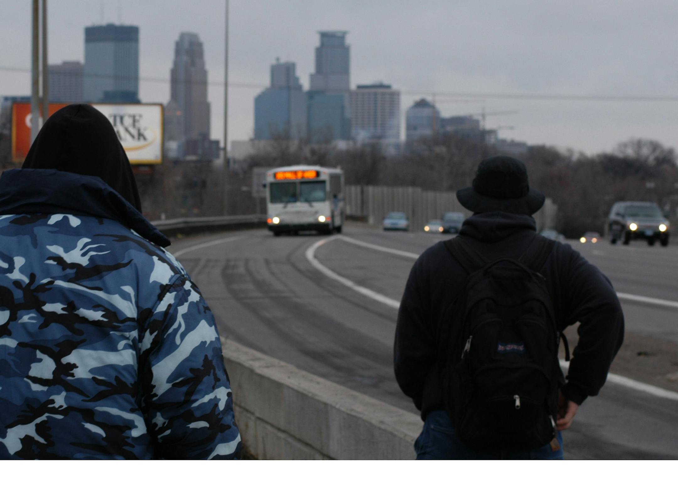 Metro Transit riders wait for a bus at Interstate 35W and Lake Street in Minneapolis.