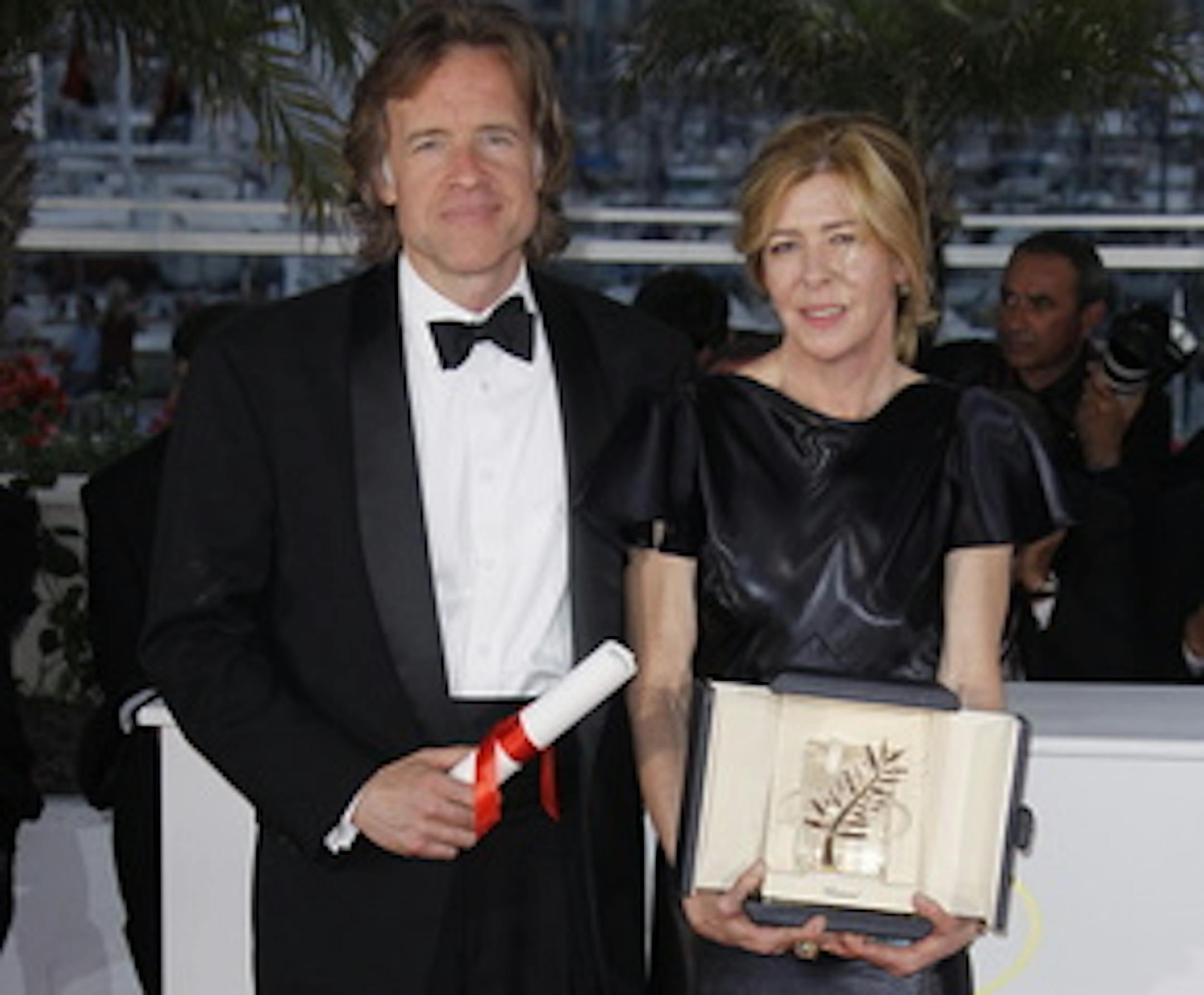Producers Bill Pohlad and Dede Gardner hold the Palme d'Or for "The Tree of Life" at Cannes. Associated Press"