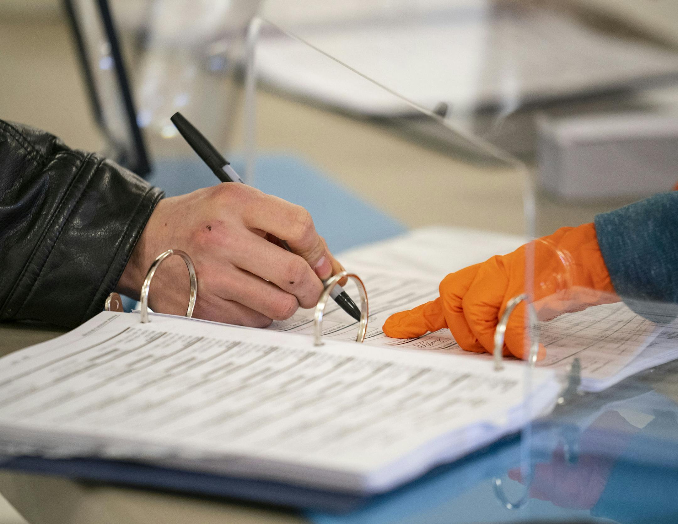 Elijah Gonalakis signed his name in order to receive a ballot at the Billings Park Civic Center on Tuesday. ]
ALEX KORMANN • alex.kormann@startribune.com Wisconsin primaries took place on Tuesday April 7, 2020 in the middle of the COVID-19 pandemic. Wisconsin governor Tony Evers issued an executive order on Monday to postpone the primaries until June but the state supreme court overruled the order.