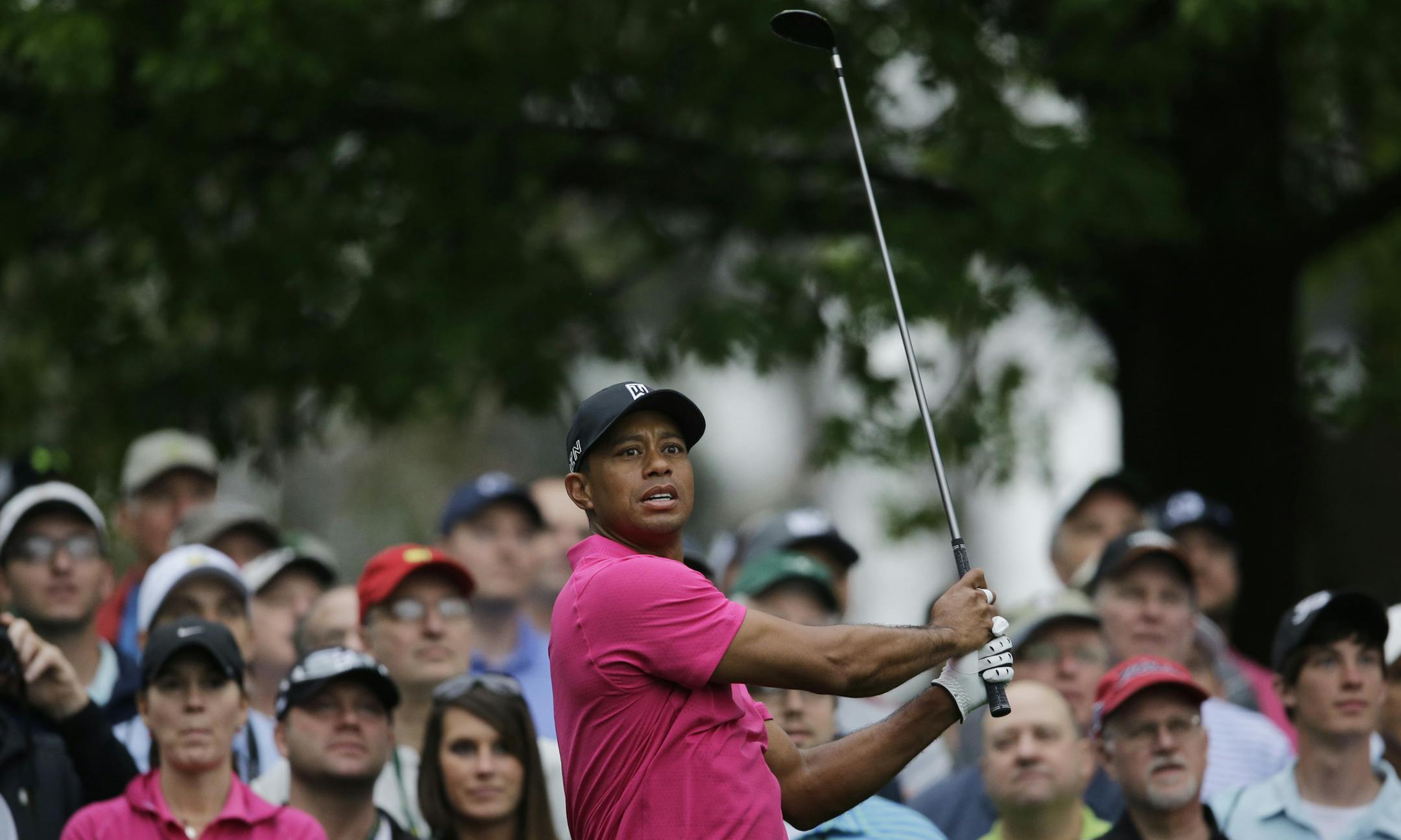 Tiger Woods watches his tee shot on the fourth hole during a practice round for the Masters golf tournament Tuesday, April 7, 2015, in Augusta, Ga. (AP Photo/Matt Slocum)