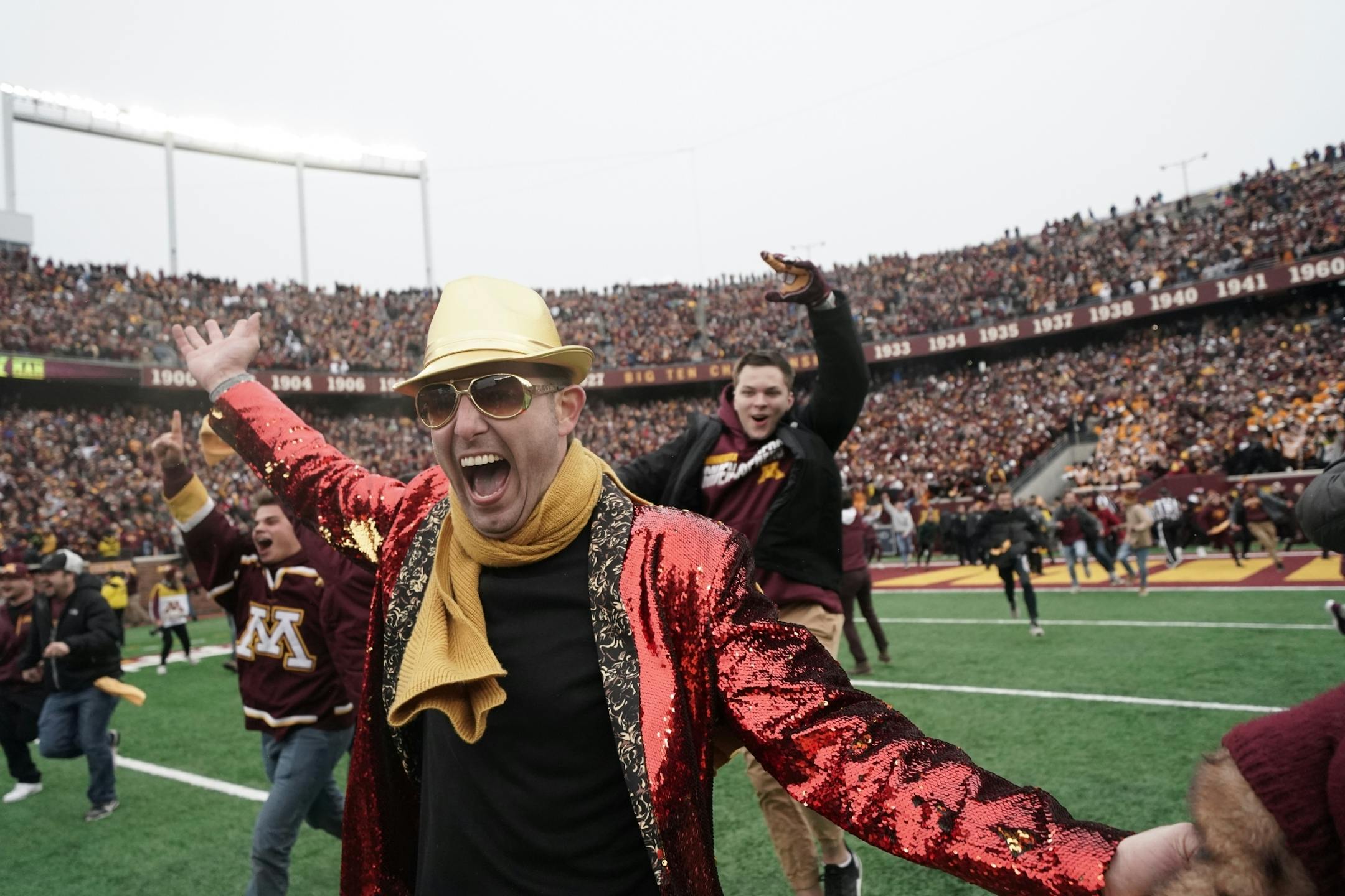 Thousands of Gophers fans stormed the field after Minnesota's 31-26 victory over Penn State.