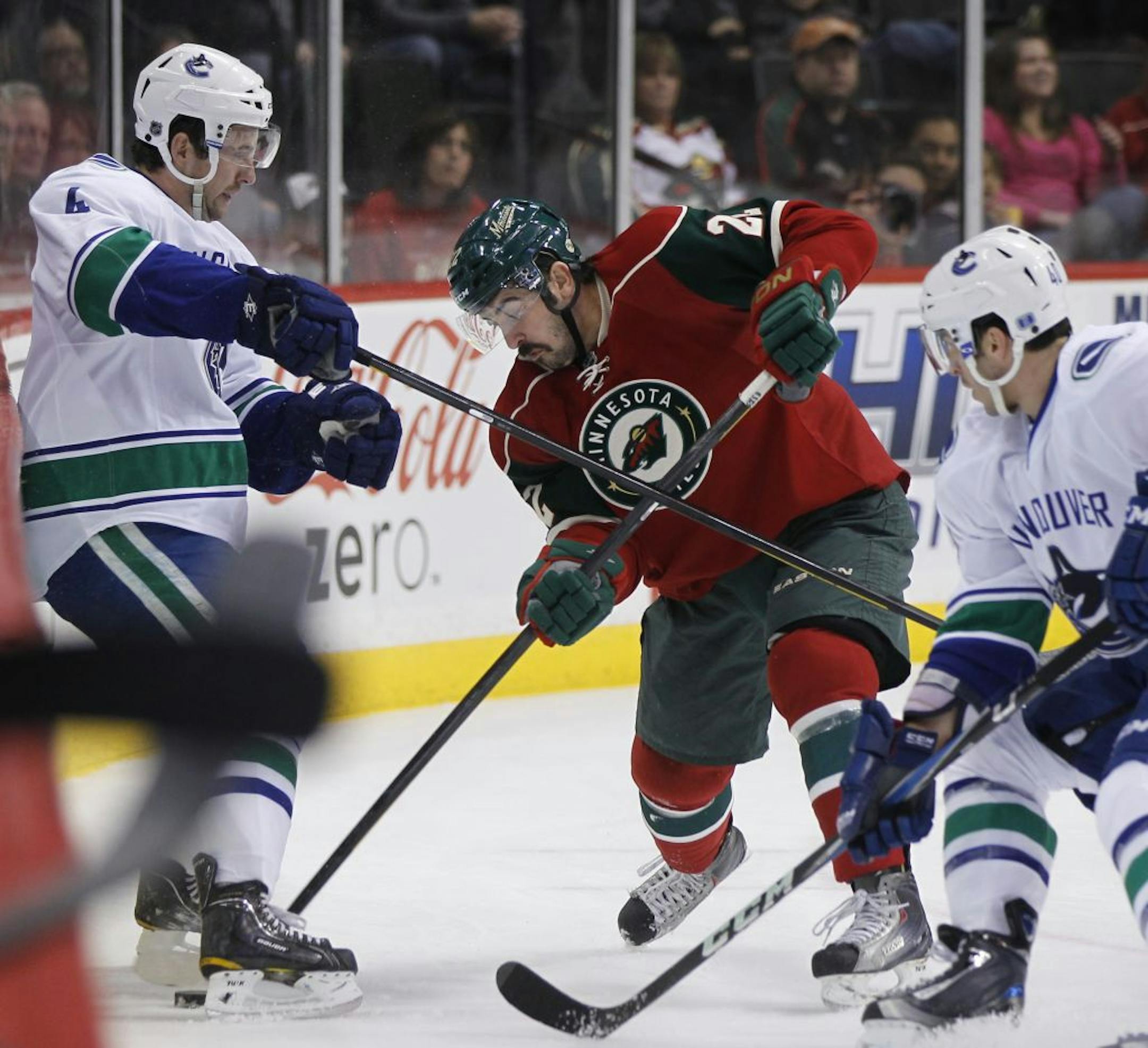 Wild forward Cal Clutterbuck (center)