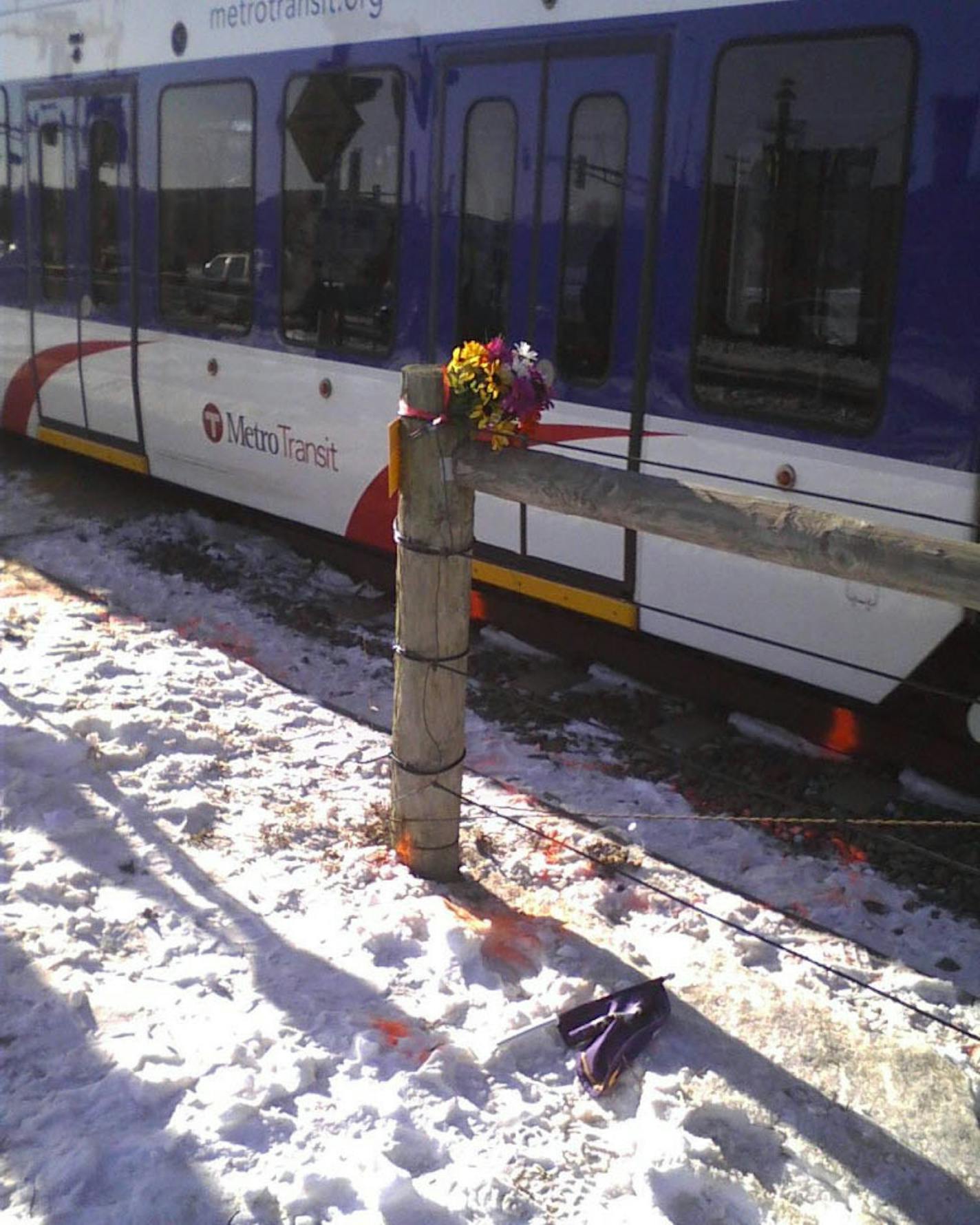 Flowers marked the scene of Sunday's fatal light-rail crash.