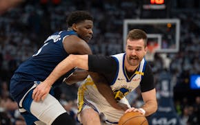 Timberwolves guard Anthony Edwards (5) defends against Golden State Warriors guard Pat Spencer (61) on Thursday night.