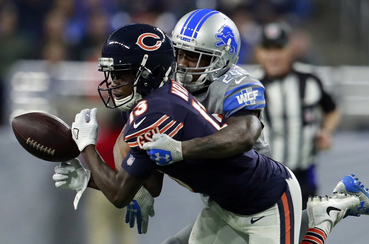 Detroit Lions cornerback Nevin Lawson (24) deflects a pass intended for Chicago Bears wide receiver Kendall Wright (13) during the second half of an NFL football game, Saturday, Dec. 16, 2017, in Detroit. (AP Photo/Rey Del Rio)