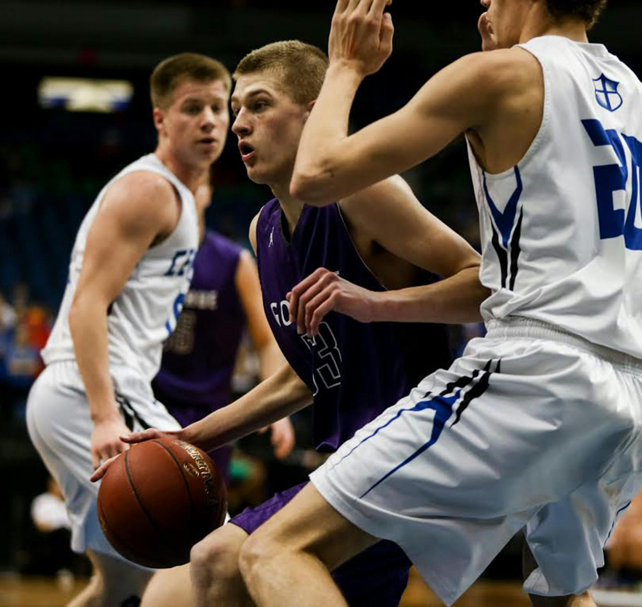Goodhue Gaurd, Taylor Buck, dribbles the ball against Central MN Christian defensive. ] ELIZABETH BRUMLEY brumley.elizabeth@gmail.com 2016 boys basketball state tournament * Central MN Christian vs. Goodhue, class 1A semi finals.